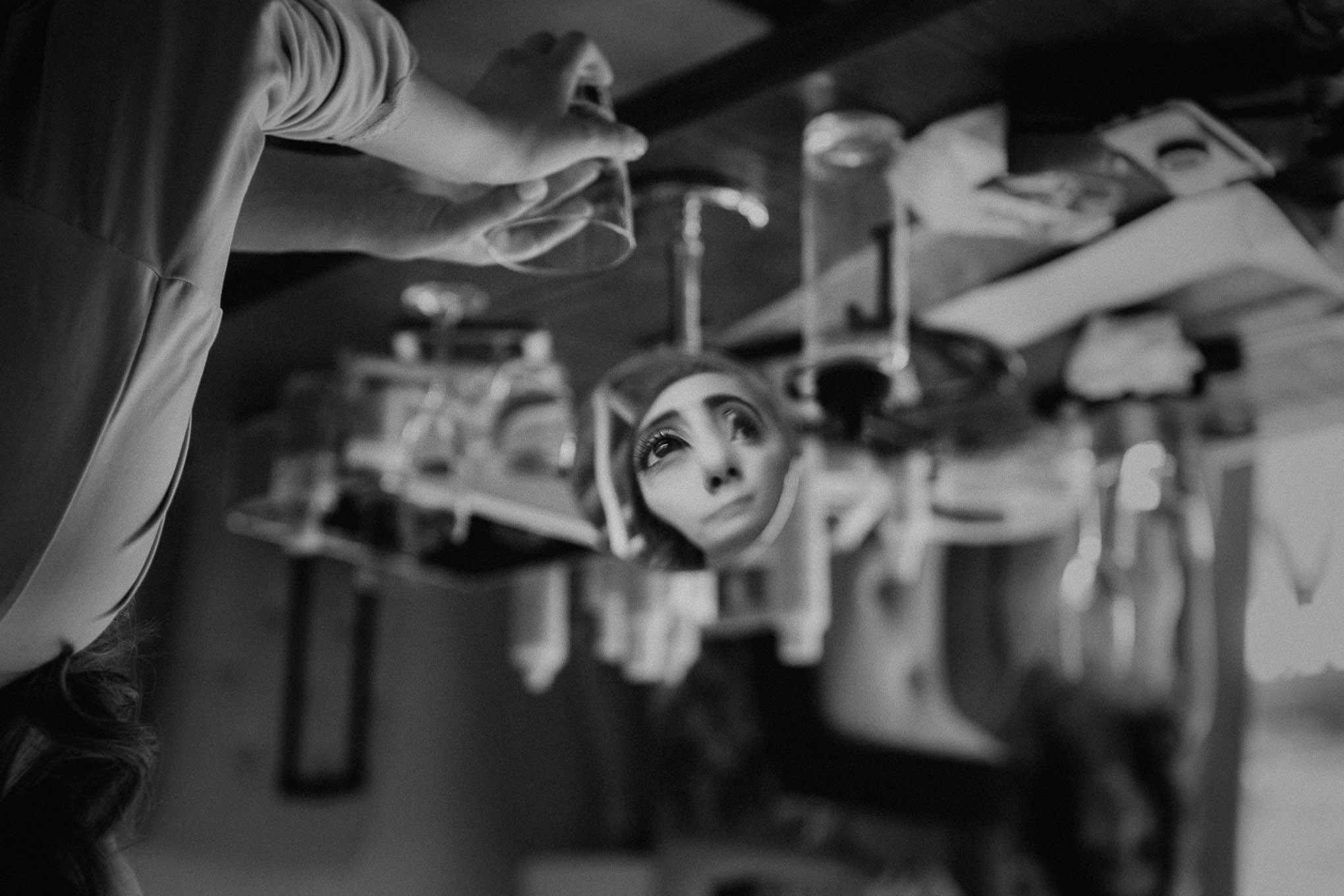 Distorted portrait of a bridesmaid in a mirror