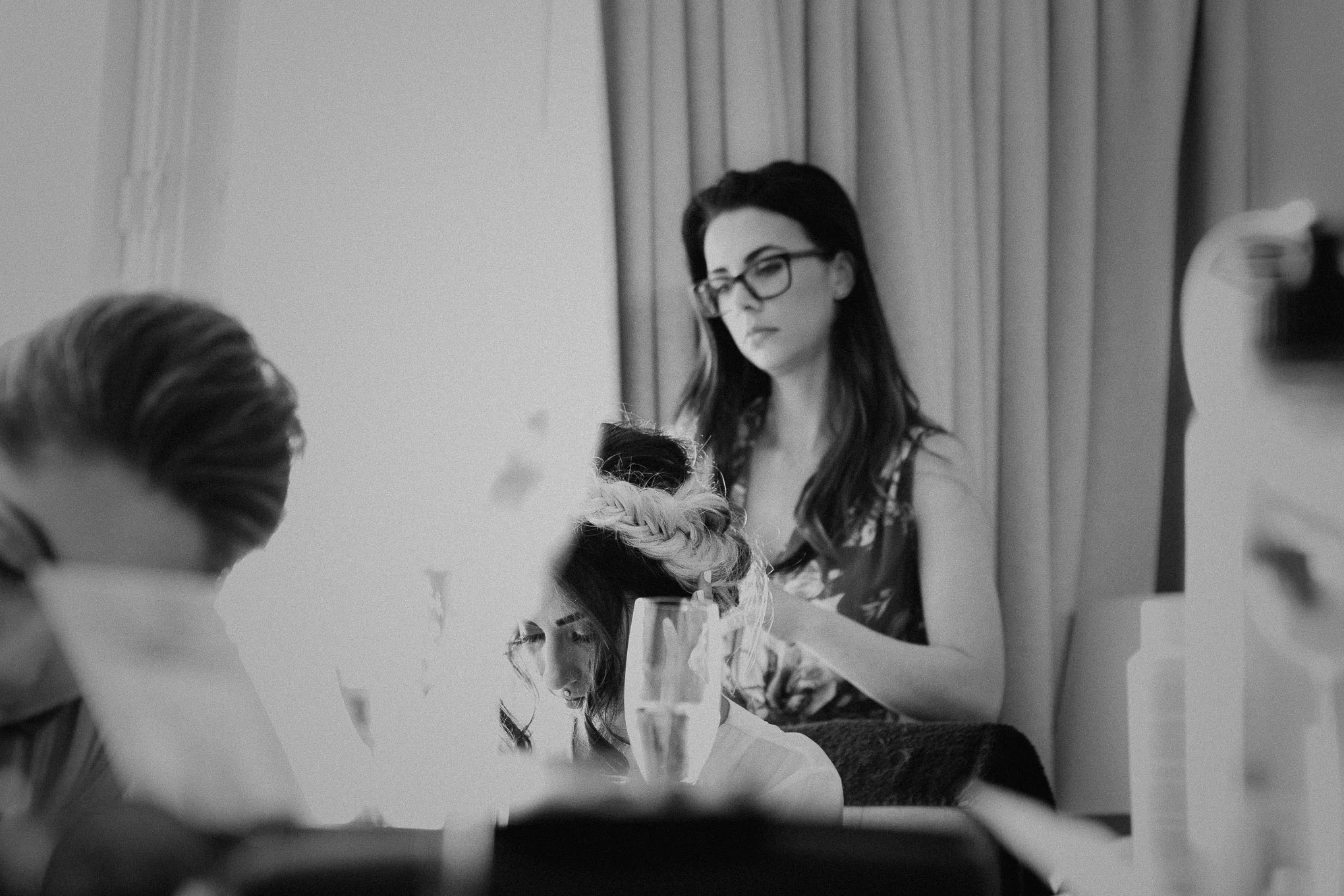 Bride getting her hair done before the wedding