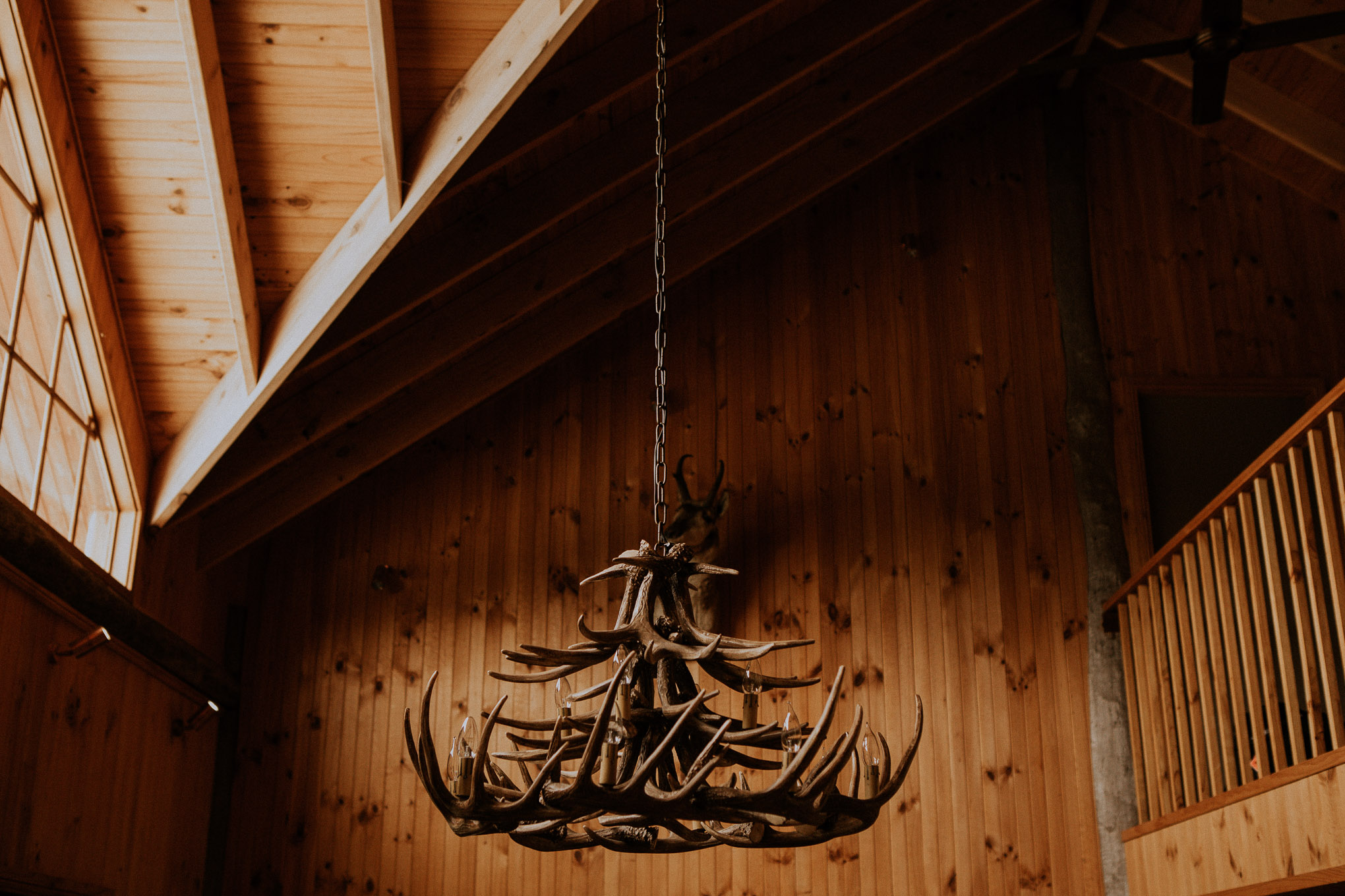 Wooden antler chandelier in timber cabin at Waldara Farm Wedding Venue