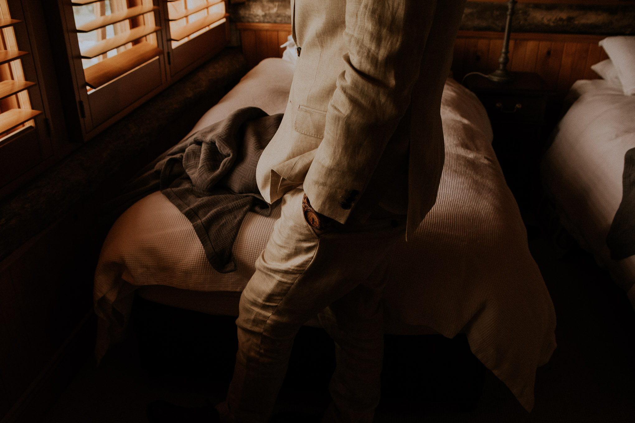 Groom's portraits in rustic timber cabin at Waldara Farm