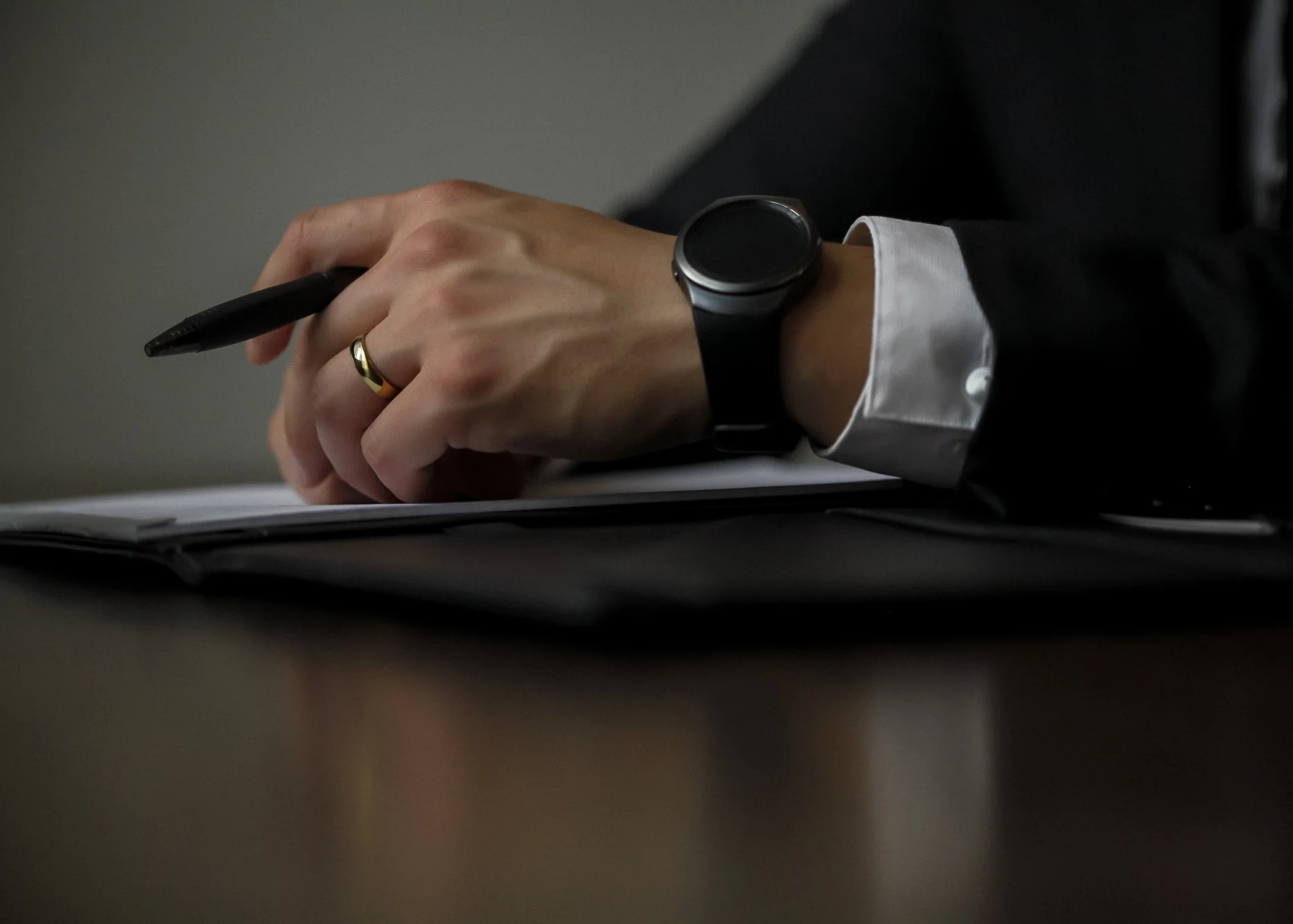 A man with an investigation report in front of him.jpg