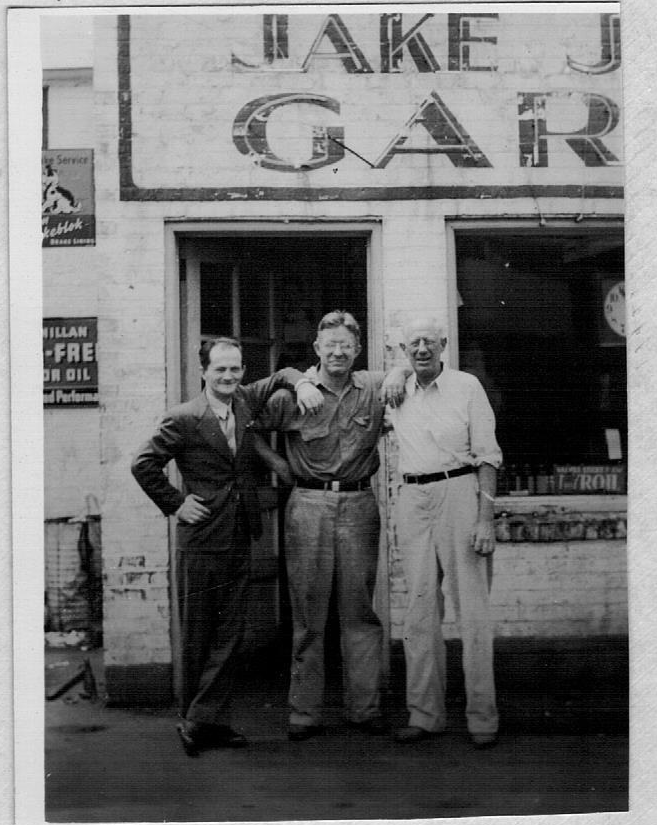 John Jr. (Jake) in middle with his brother Henry on right and a customer on left.