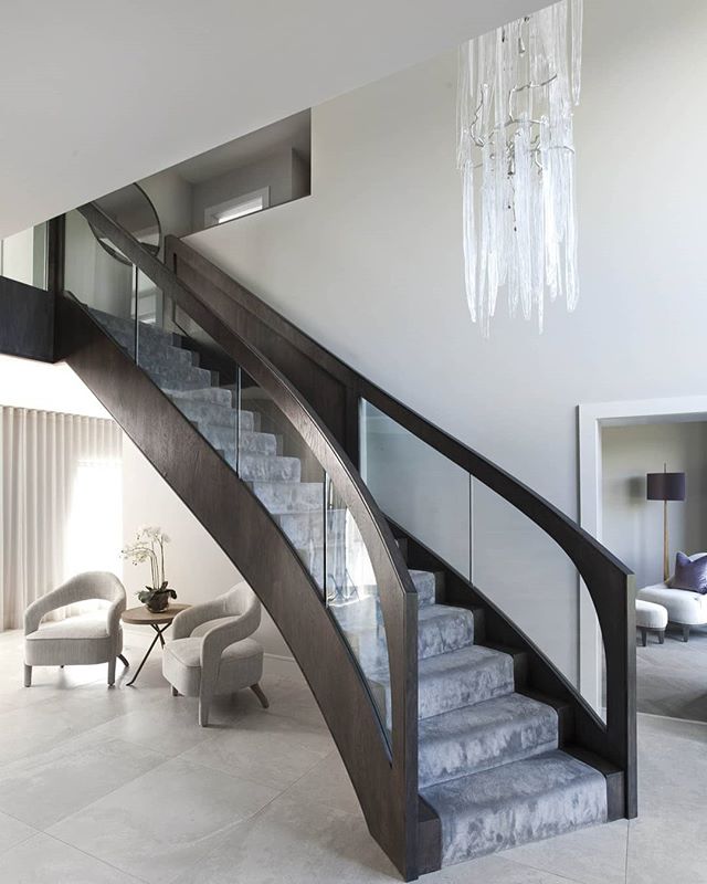 Another view showing off this unbelievable contemporary staircase, looking into TV room.  #interiordesigner #interiorarchitecture #classiccontemporary #contemporaryinteriors #furnituredesign #home #interior123 #homedecorinspo #instahome #luxuryinteri