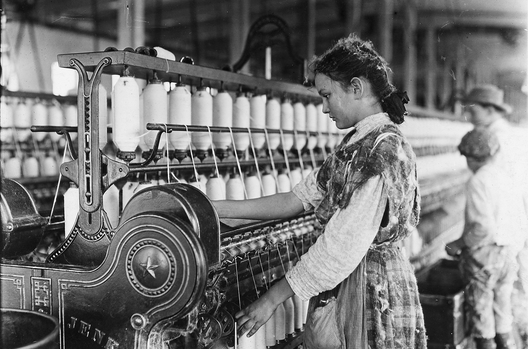 THREADS - Pic of spinner at machine.png