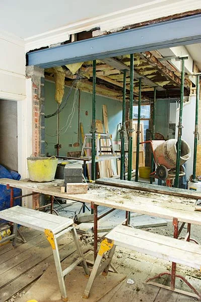 Before removing load-bearing walls consult the advice of a structural engineer. You will also need Building Regulations approval