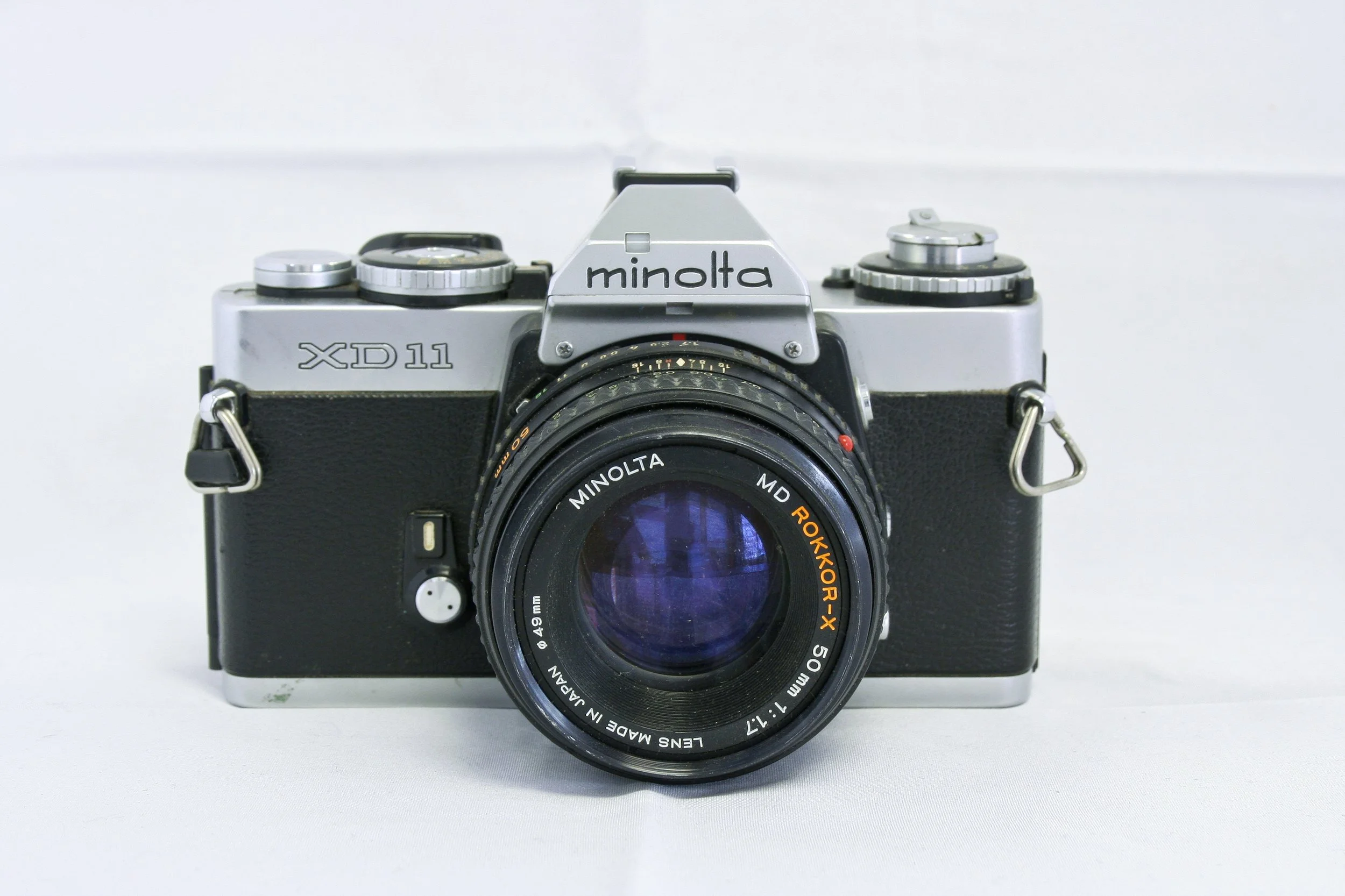 Minolta XD 11 w/ 50mm Rokkor X lens (*) — Camera Center