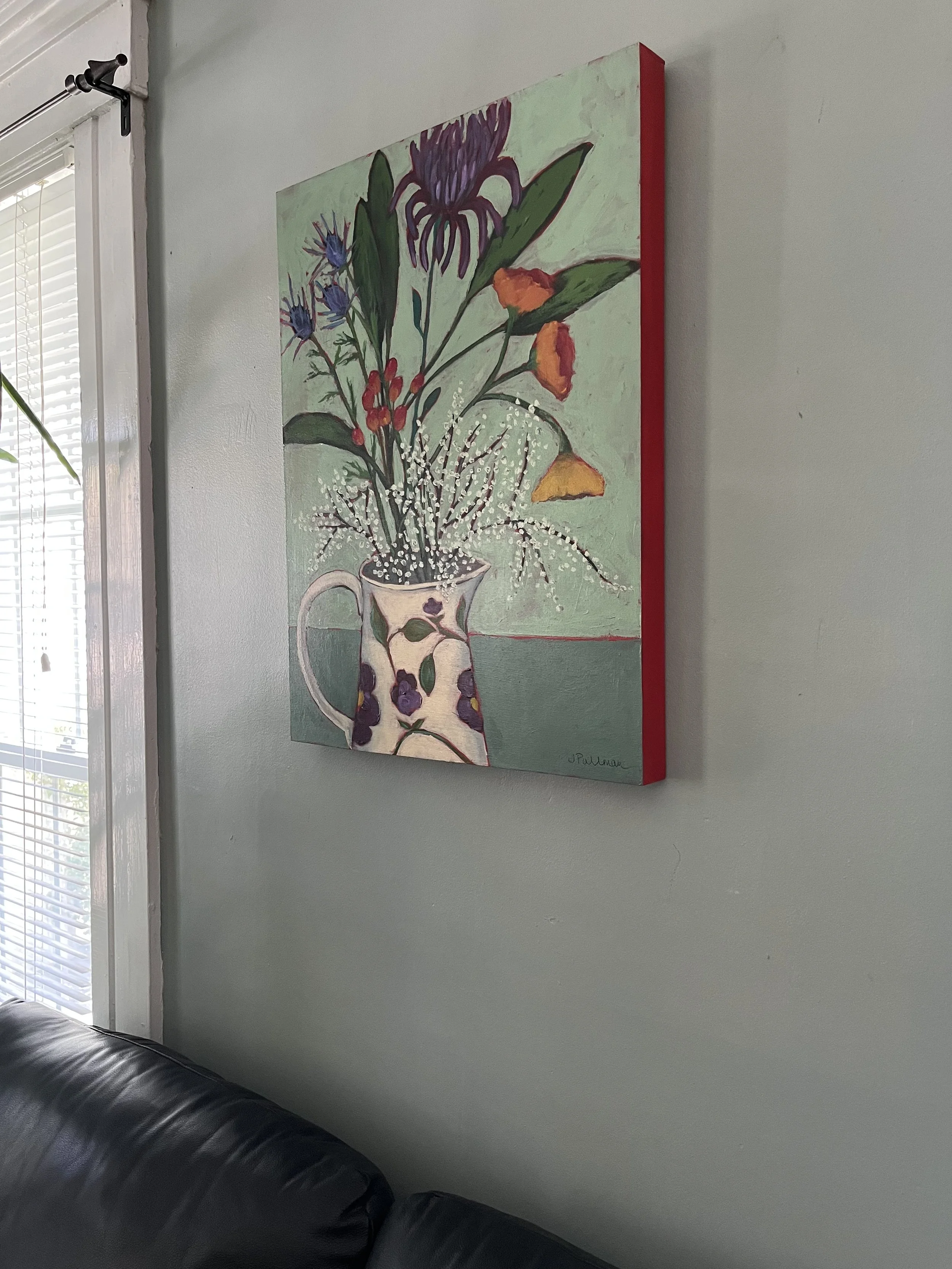 flower pitcher on wall.jpeg