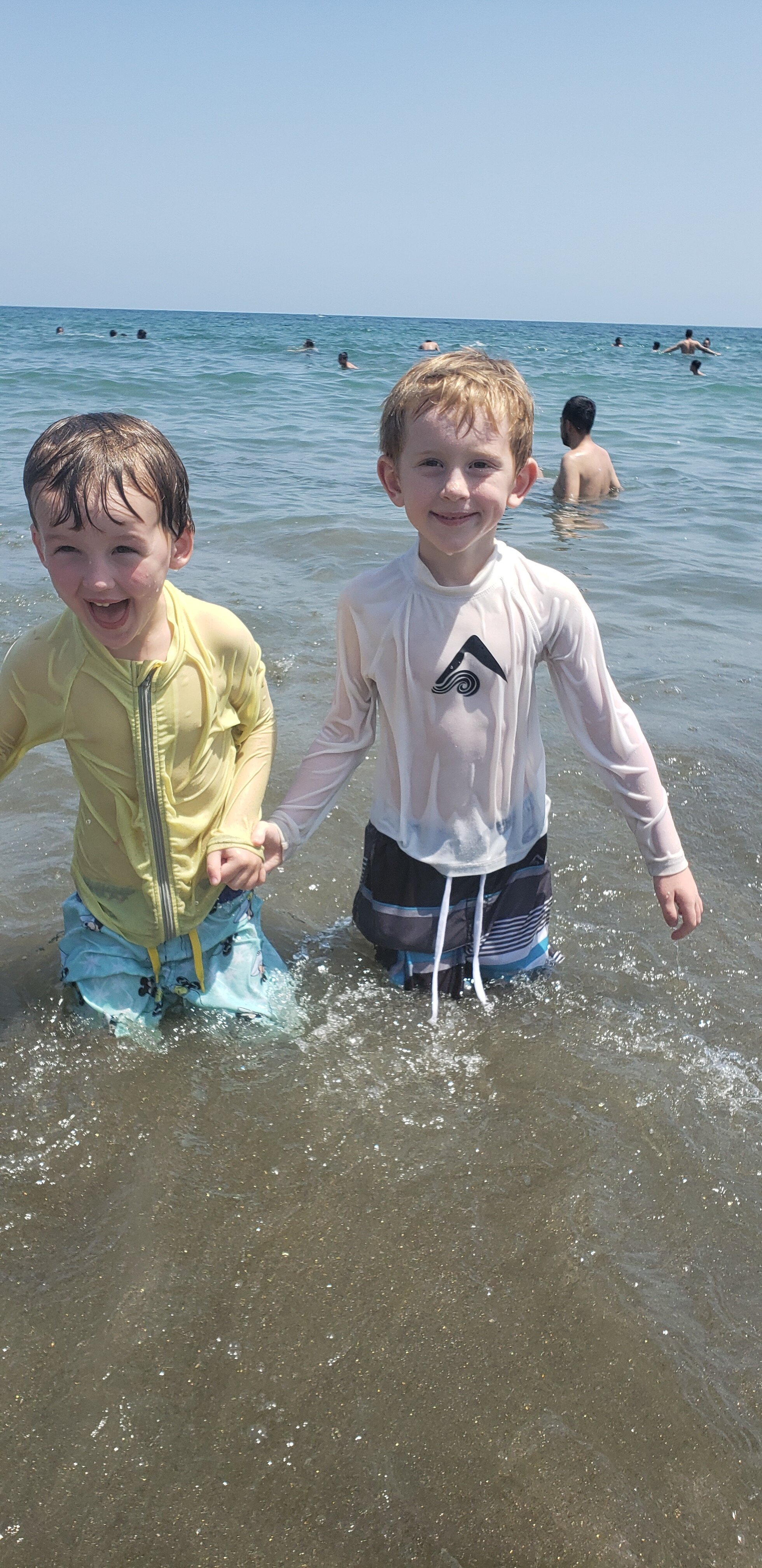 Grayson and Keegan having a blast in the ocean in Sayulita.