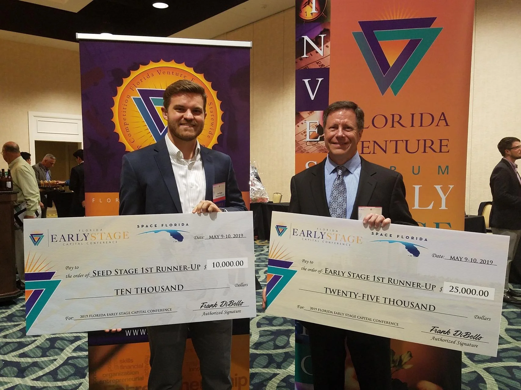 Joe Sleppy (left) of Capacitech Energy and Rodney Bosley (right) of SegAna at the Florida Venture Forum award ceremony in the Omni Resort in Orlando, Florida.