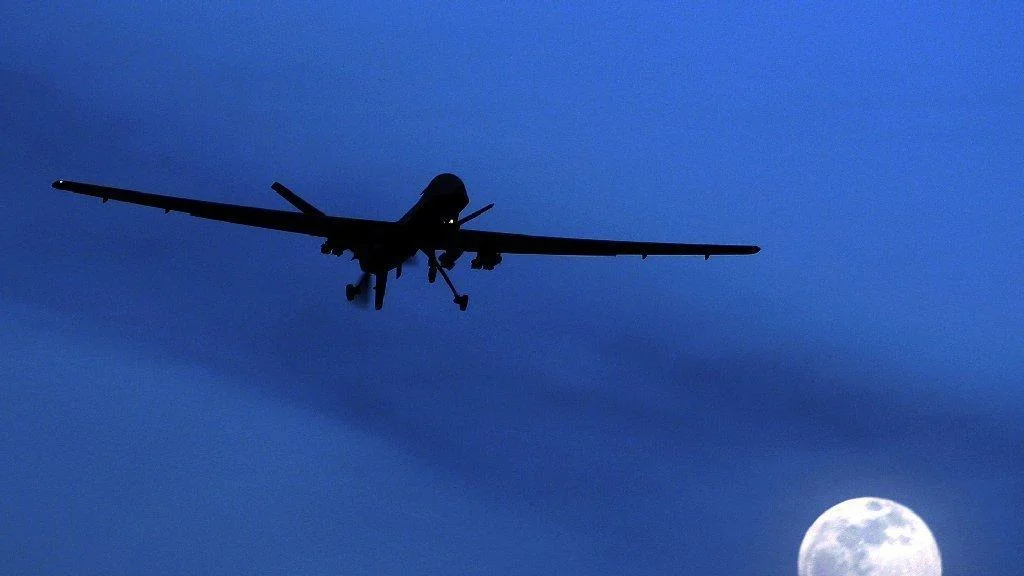 An unmanned U.S. drone, seen here in 2010, flies over Kandahar, Afghanistan. (Kirsty Wigglesworth / Associated Press)