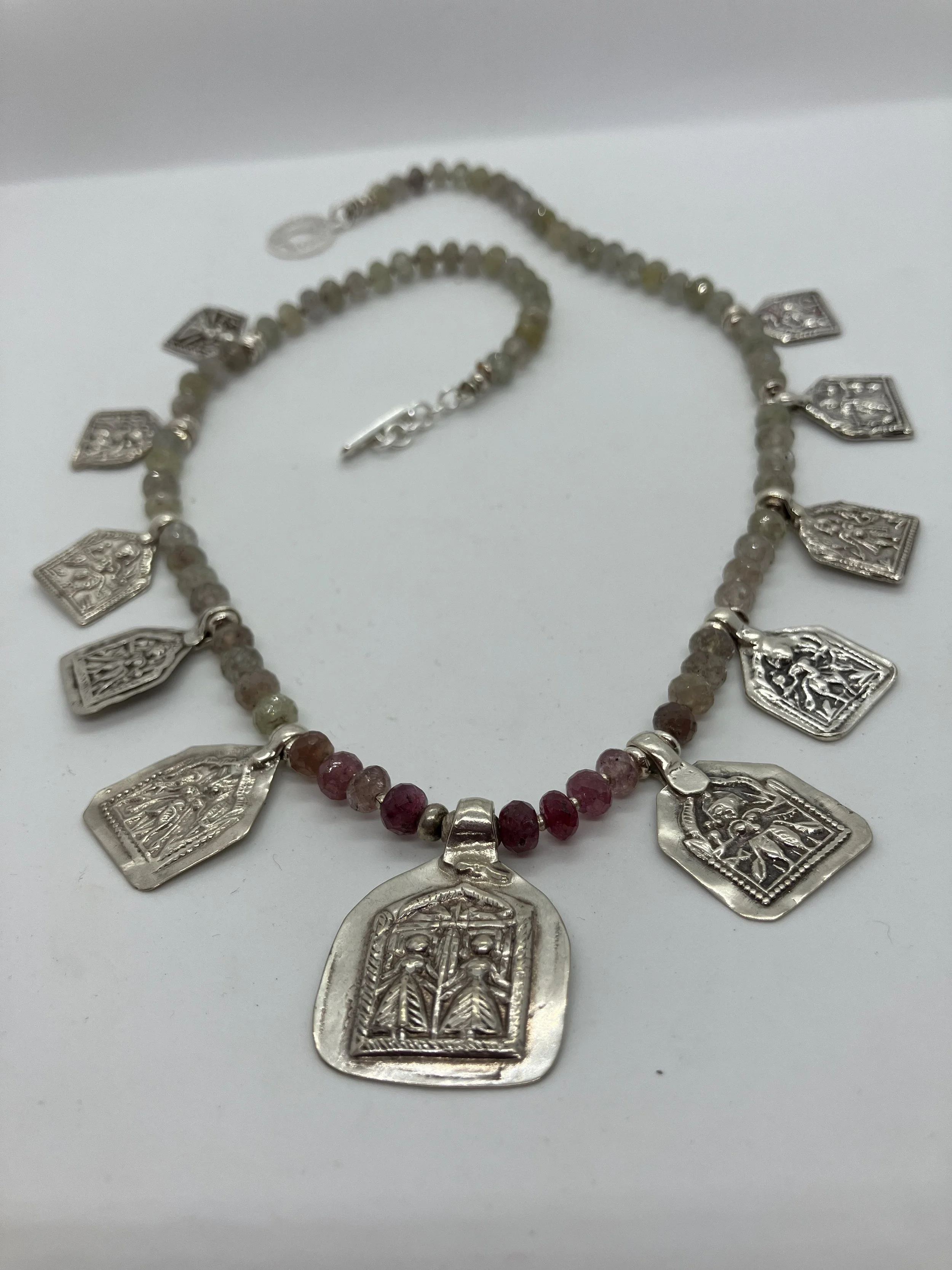 Faceted grey and rose Fancy Emeralds with ventage Hindu talisman..