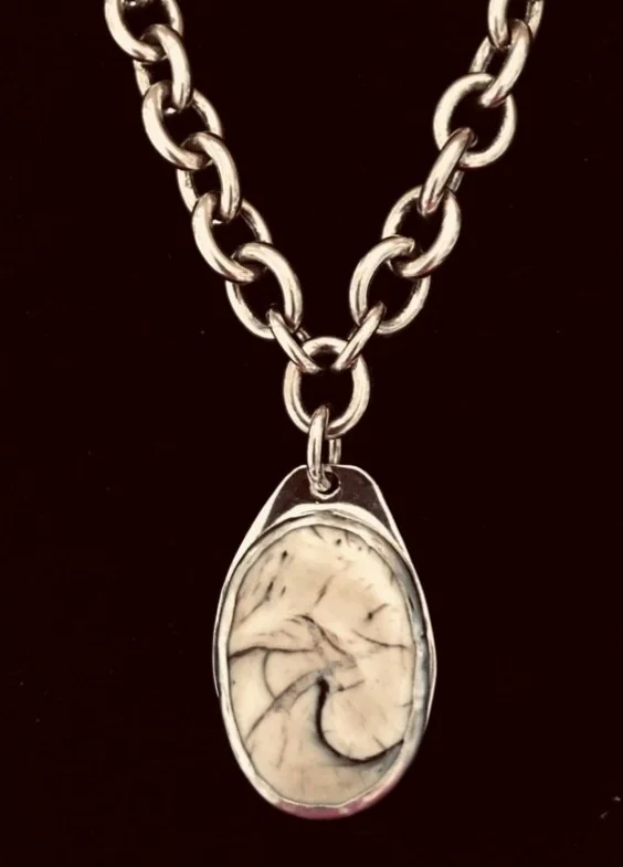 Antique shell, bezel set, silver chain