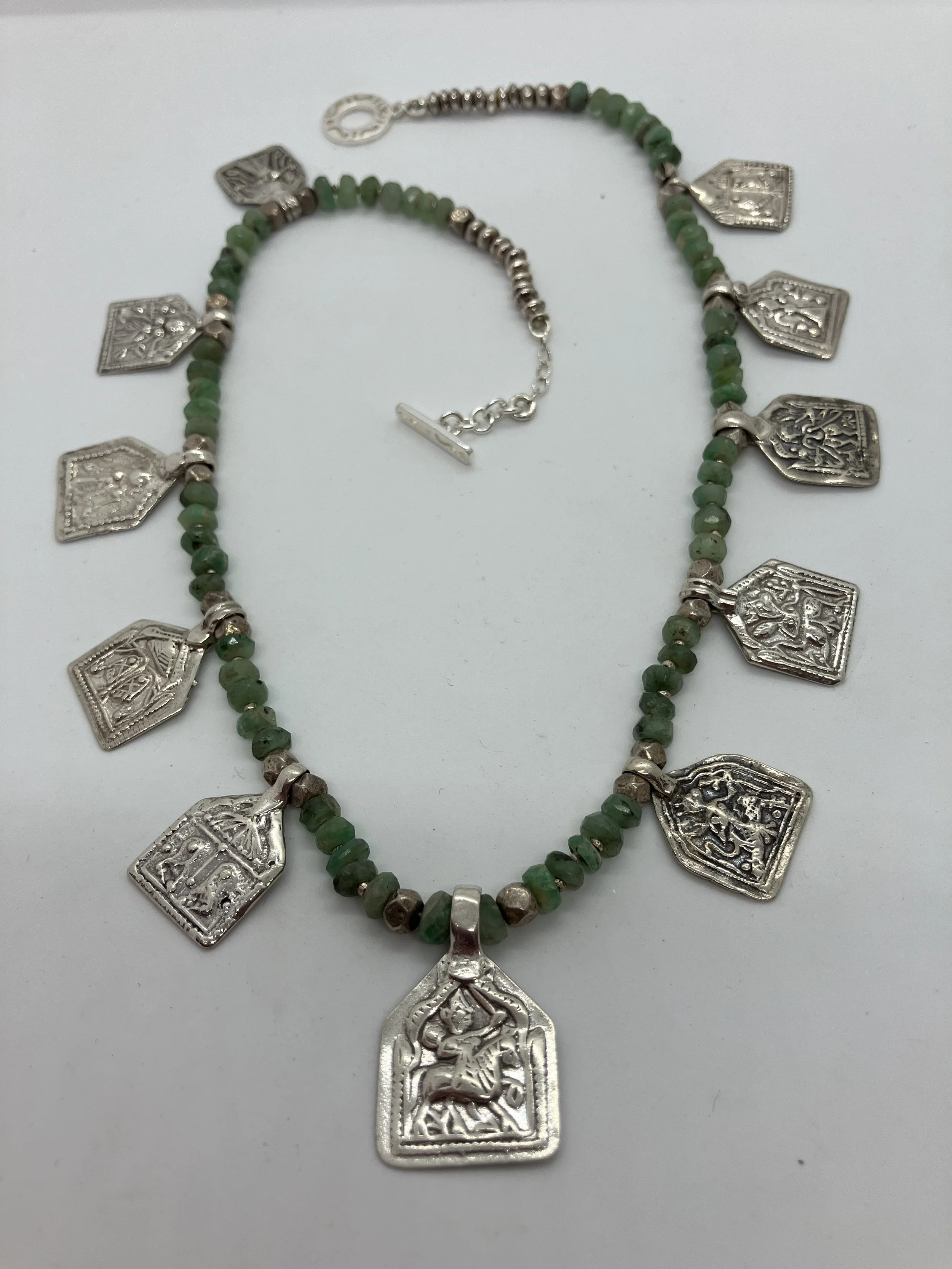 Green emerald faceted beads with antique silver Hindu charms