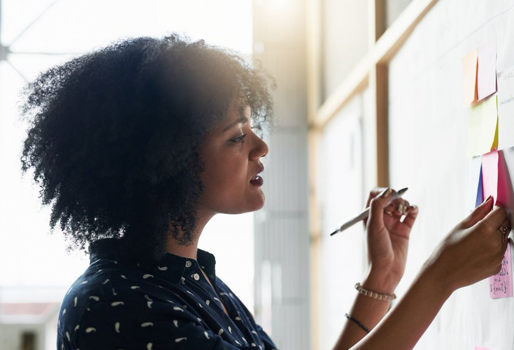 Woman at Note Board.png