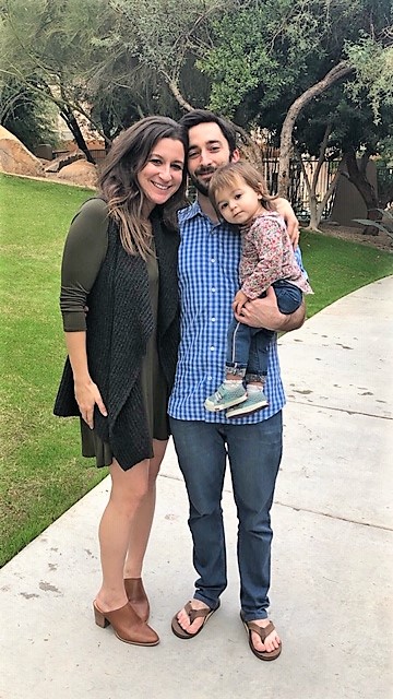 Kym with her husband and daughter.