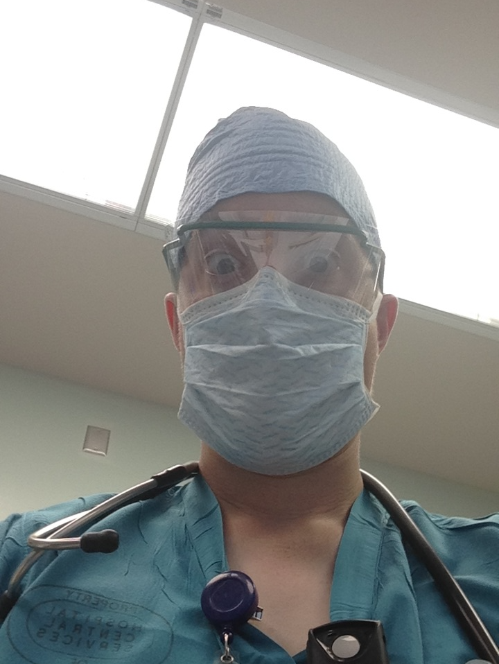 Gregory posing in his work uniform