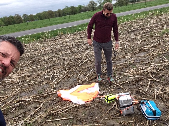 Mr. Luther and Mr. Vasquez retrieving the popped weather balloon near Bowling Green, MO.