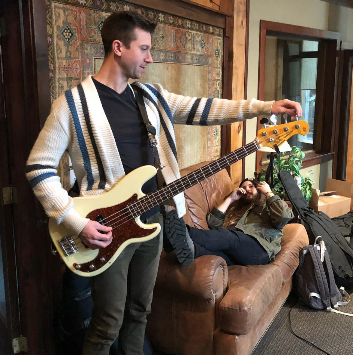 Geoffrey Maybe tunes his Chinese knock-off Fender style Bass (a THIRD of the sound of EFFORTS) in front of Noah. November 2018.