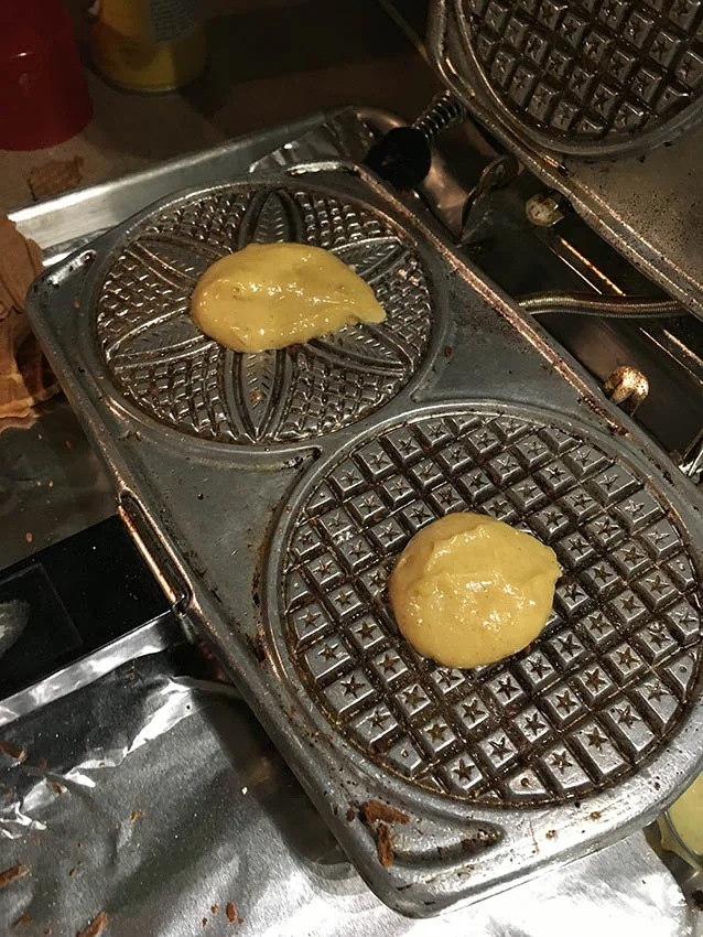 First batch of dough on the iron. Note that I have the iron sitting on a foil covered baking sheet in case any of the dough squeezed out to the side. It did, so this made for easy clean up. 