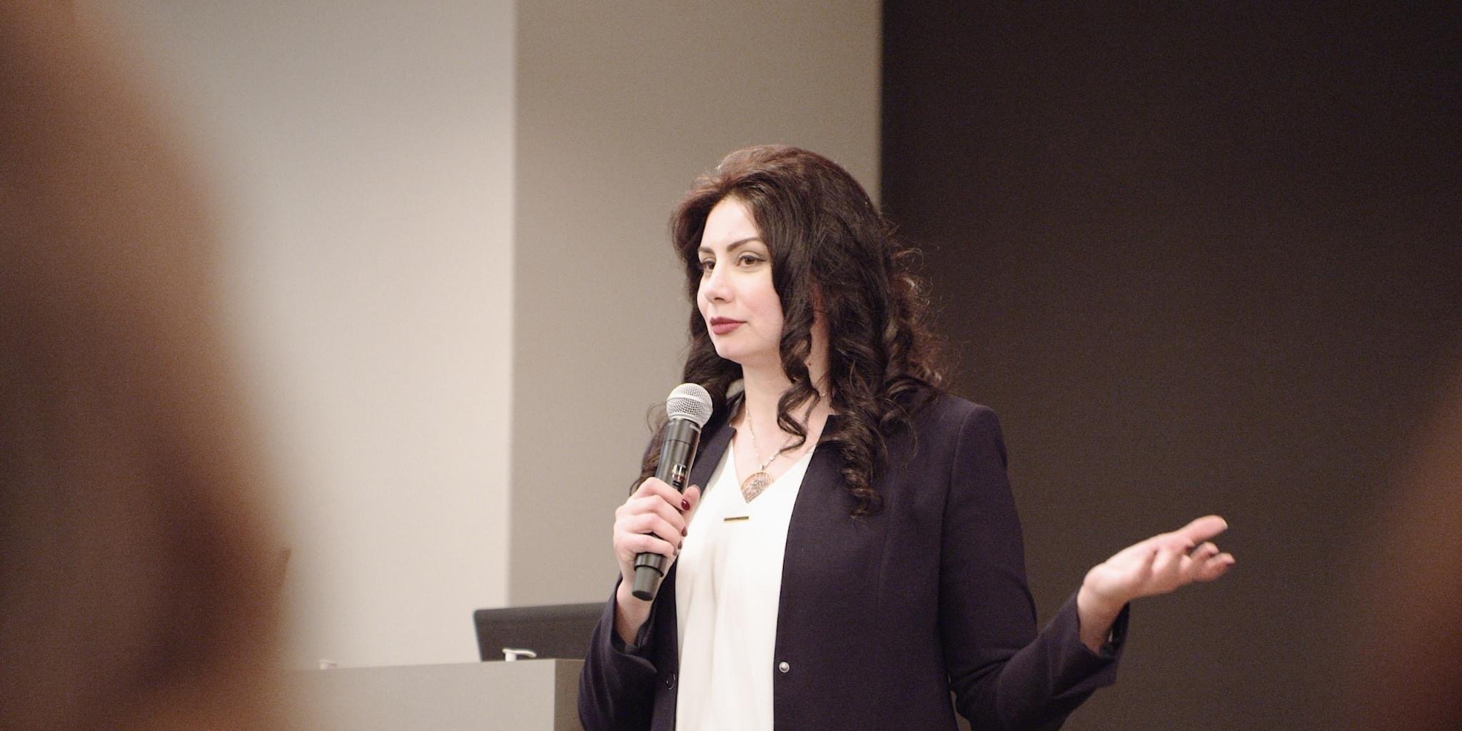 Saleheh Keen speaking during a financial education presentation