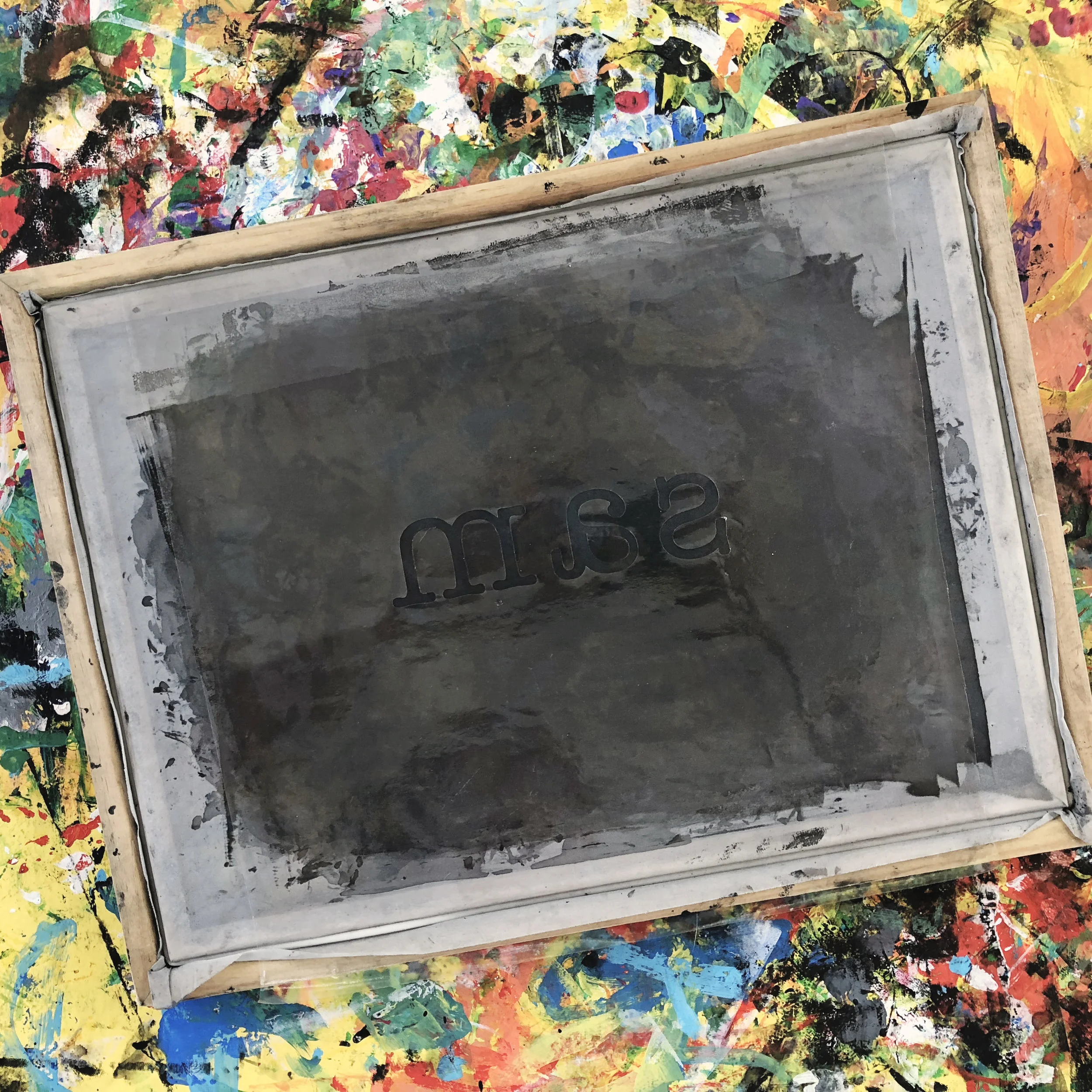 stencil applied to the back of the silkscreen