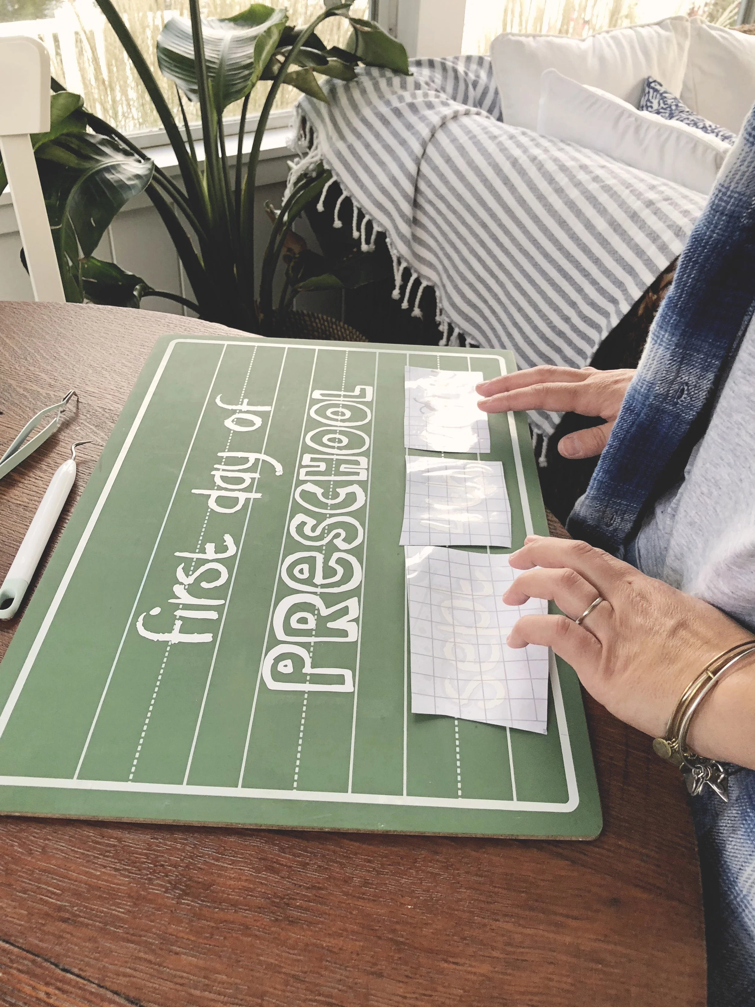 applying the vinyl to the chalkboard