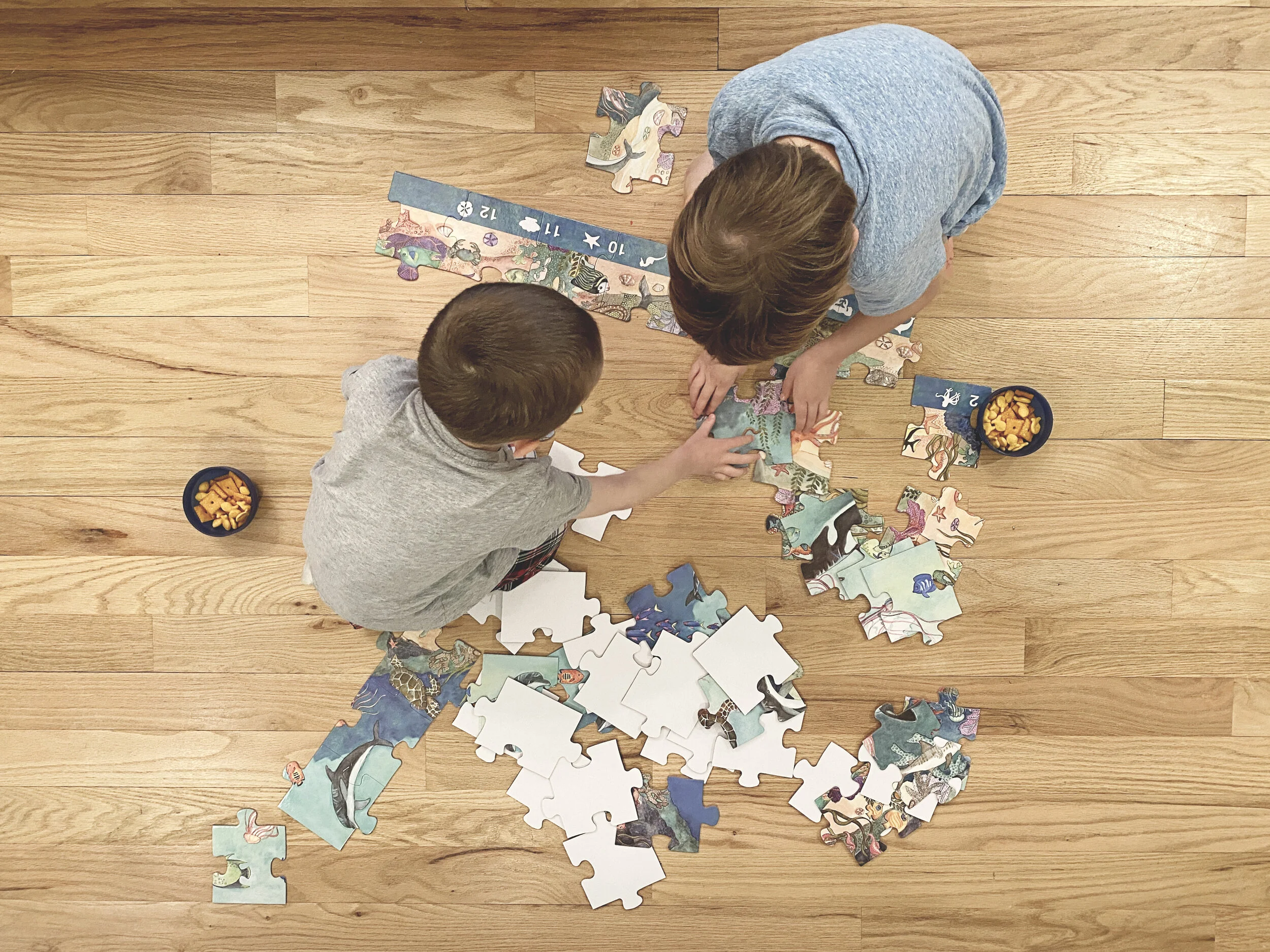 March 25th - Fisher and Jack putting together a puzzle.JPG