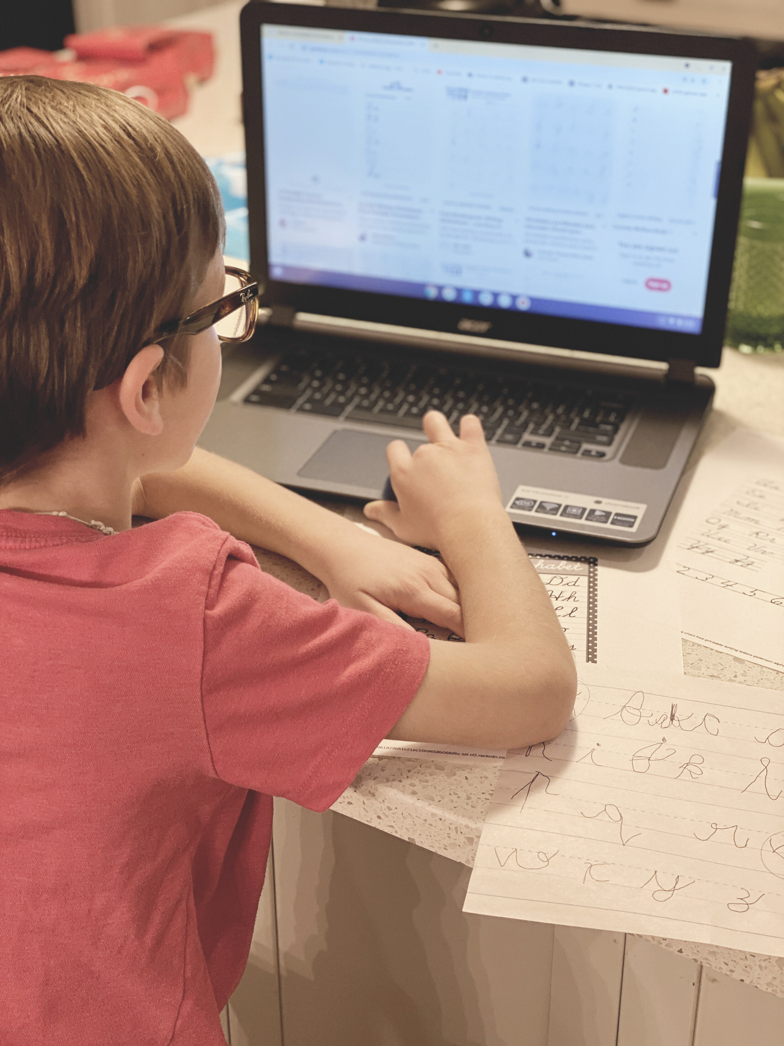 January 12th - Fisher teaching himself cursive.JPG