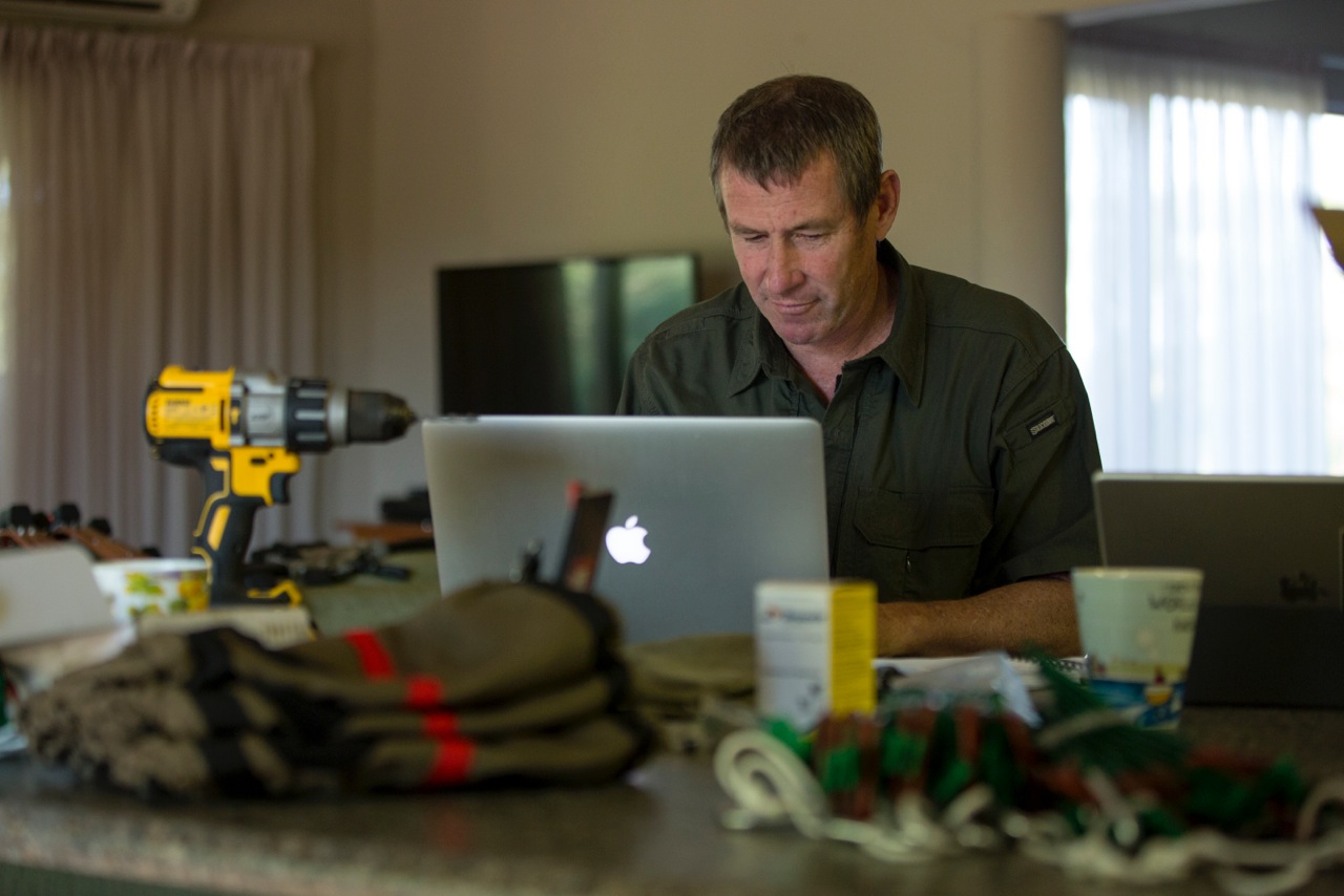 Ivan Carter logging details and cross-checking microchipping.