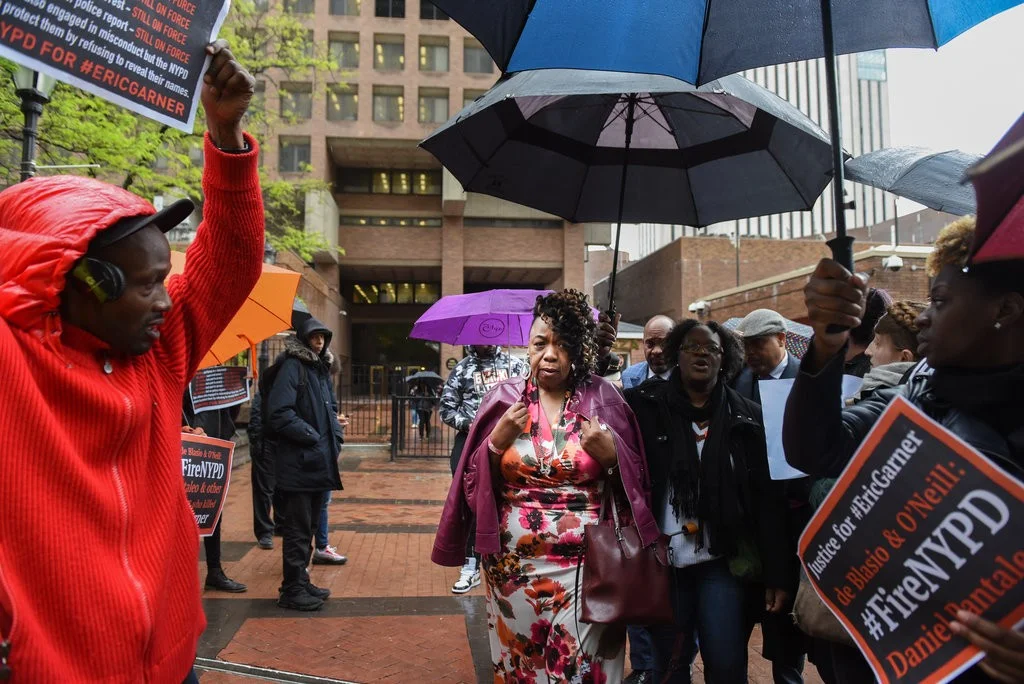 Gwen Carr, the mother of Mr. Garner, outside Police Headquarters on Monday. She left the trial weeping after prosecutors played the video of her son’s death. Credit Stephanie Keith for The New York Times