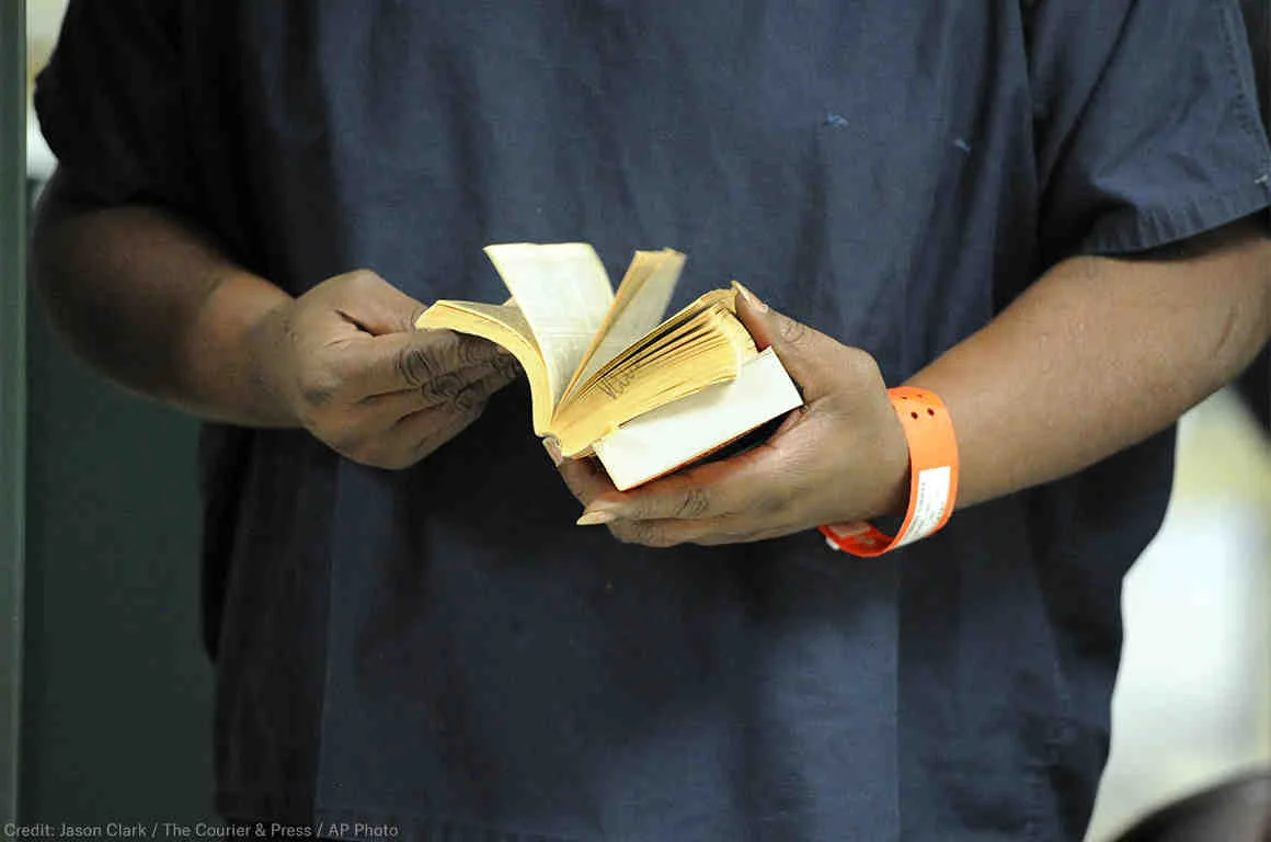 web19-incarcerated-person-reading-socialshare-1160x768.jpg