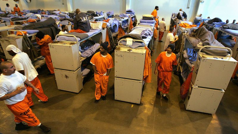 In a photograph from 2007, inmate beds fill a gymnasium converted into a temporary "emergency" sleeping area at California State Prison, Los Angeles County in Lancaster. This kind of state prison overcrowding is now a thing of the past. (Spencer Weiner / Los Angeles Times)