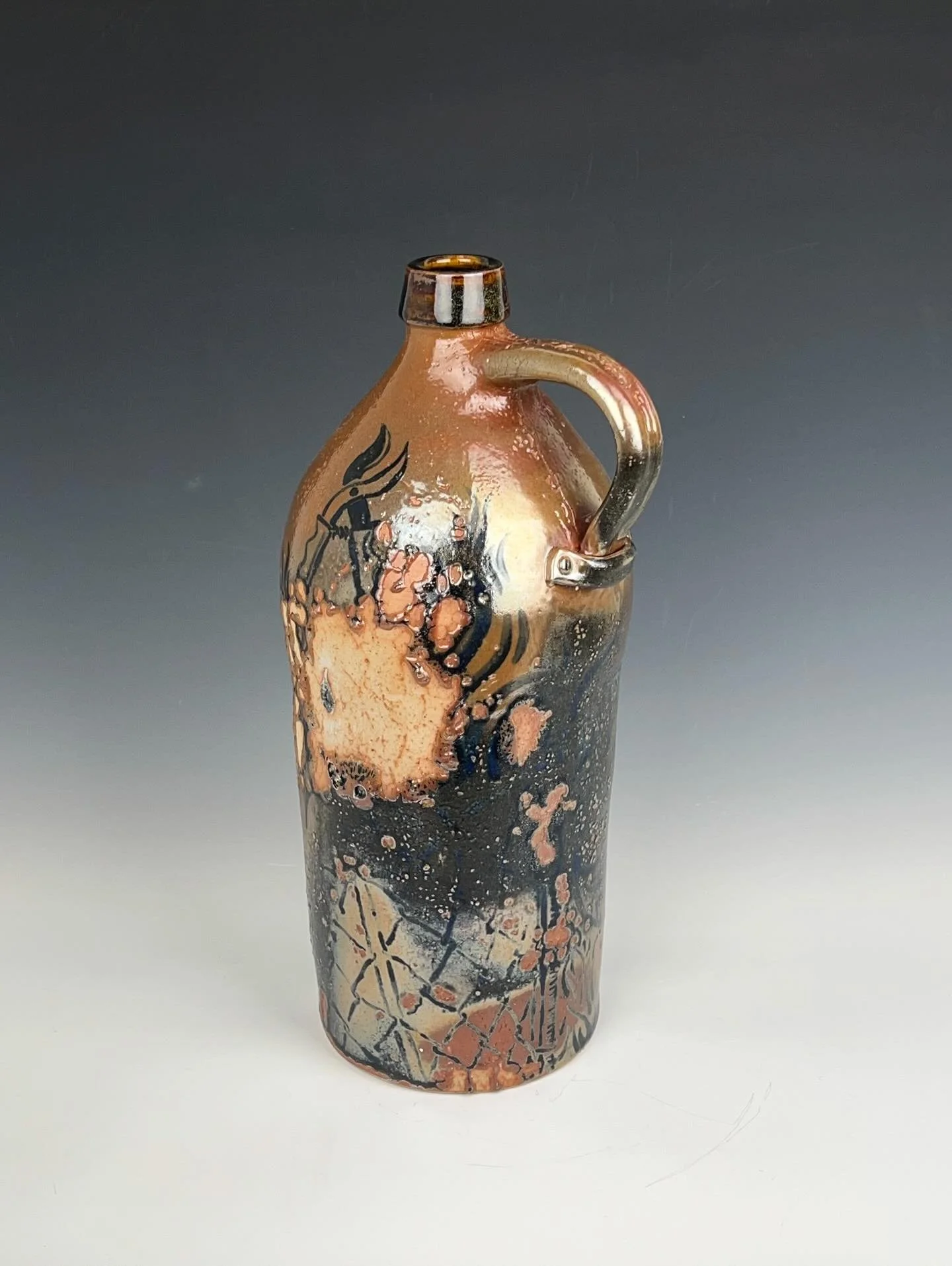 this is a large jug that I made recently with imagery of foraging, wild blue lettuce, one of my favorite edible weeds. With this work, I was trying to emulate early American folk ceramics from New England. Similar to some of the other pieces that I'v