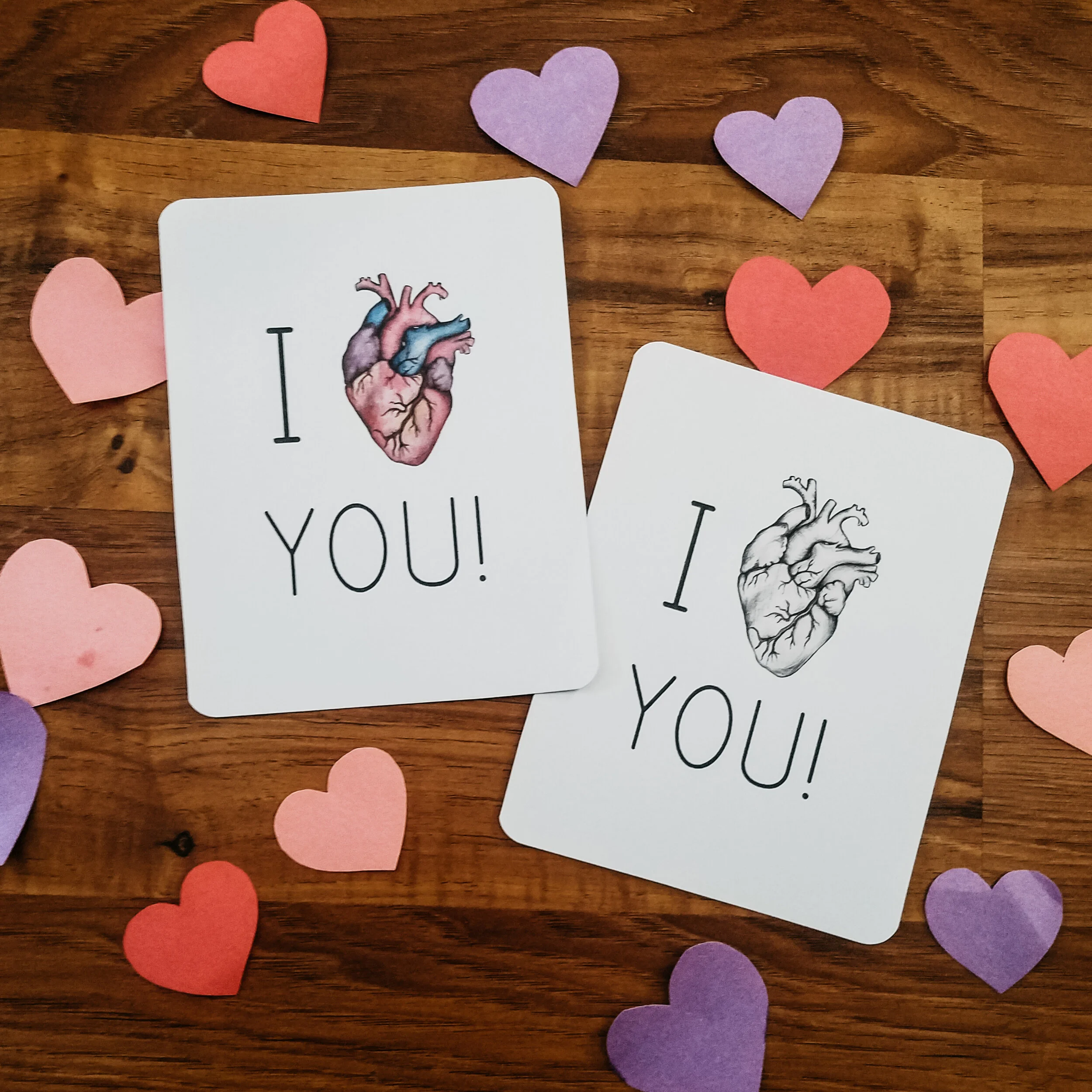 Smaller version of the I heart you card, shown in both black-and-white and full-color illustrated human heart designs.