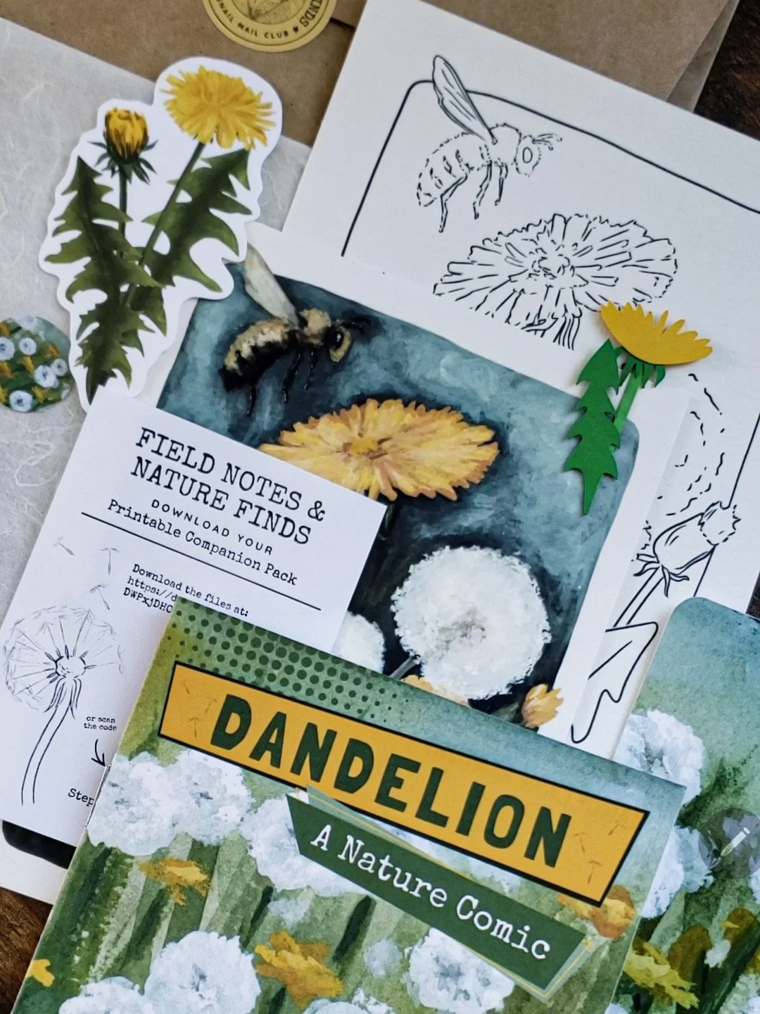 Flat lay of dandelion-themed mail items neatly arranged, showing all included pieces.
