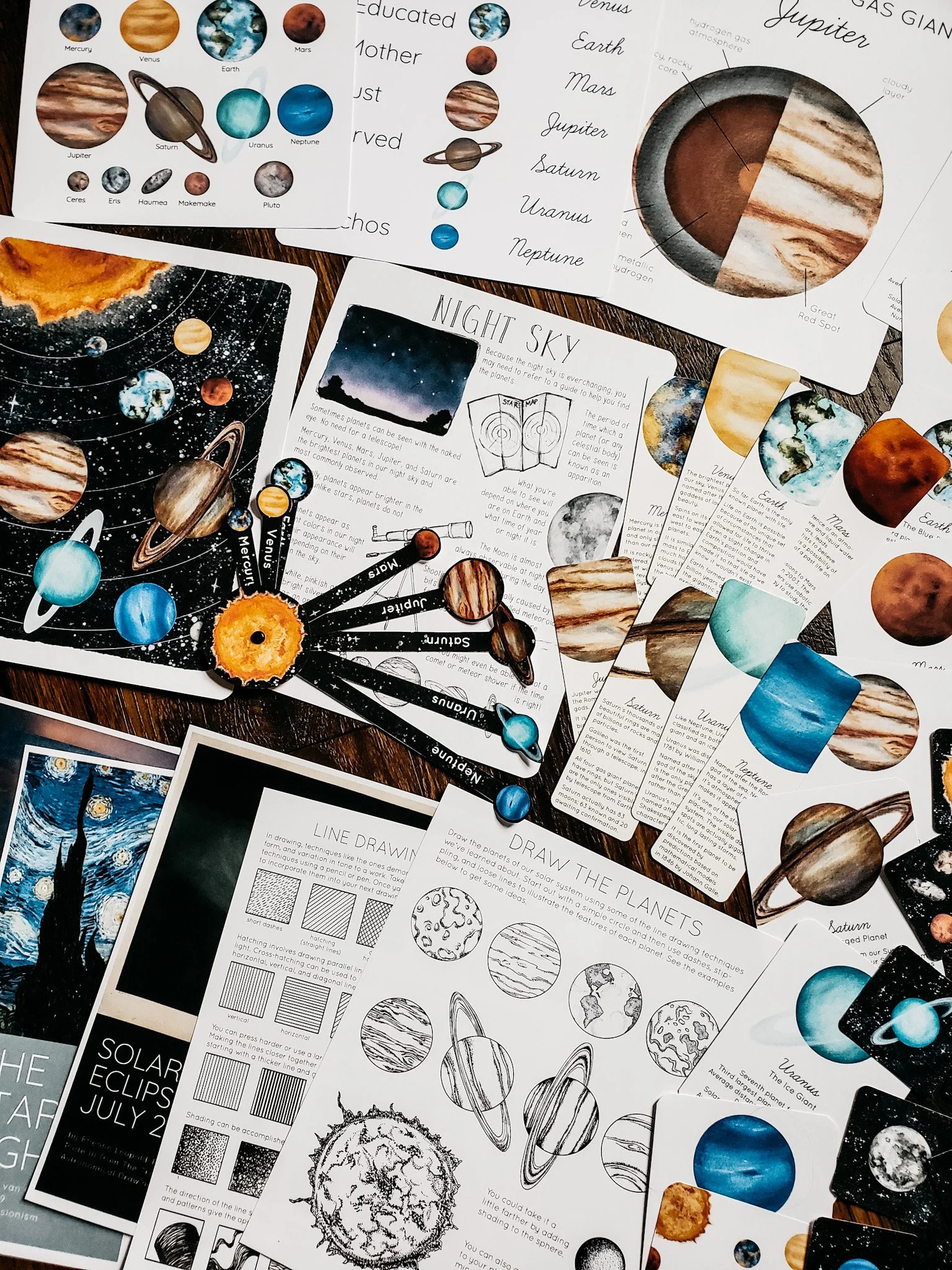 Alternate flat lay of Our Solar System Unit Study pages showing additional illustrations, charts, and activity sheets.