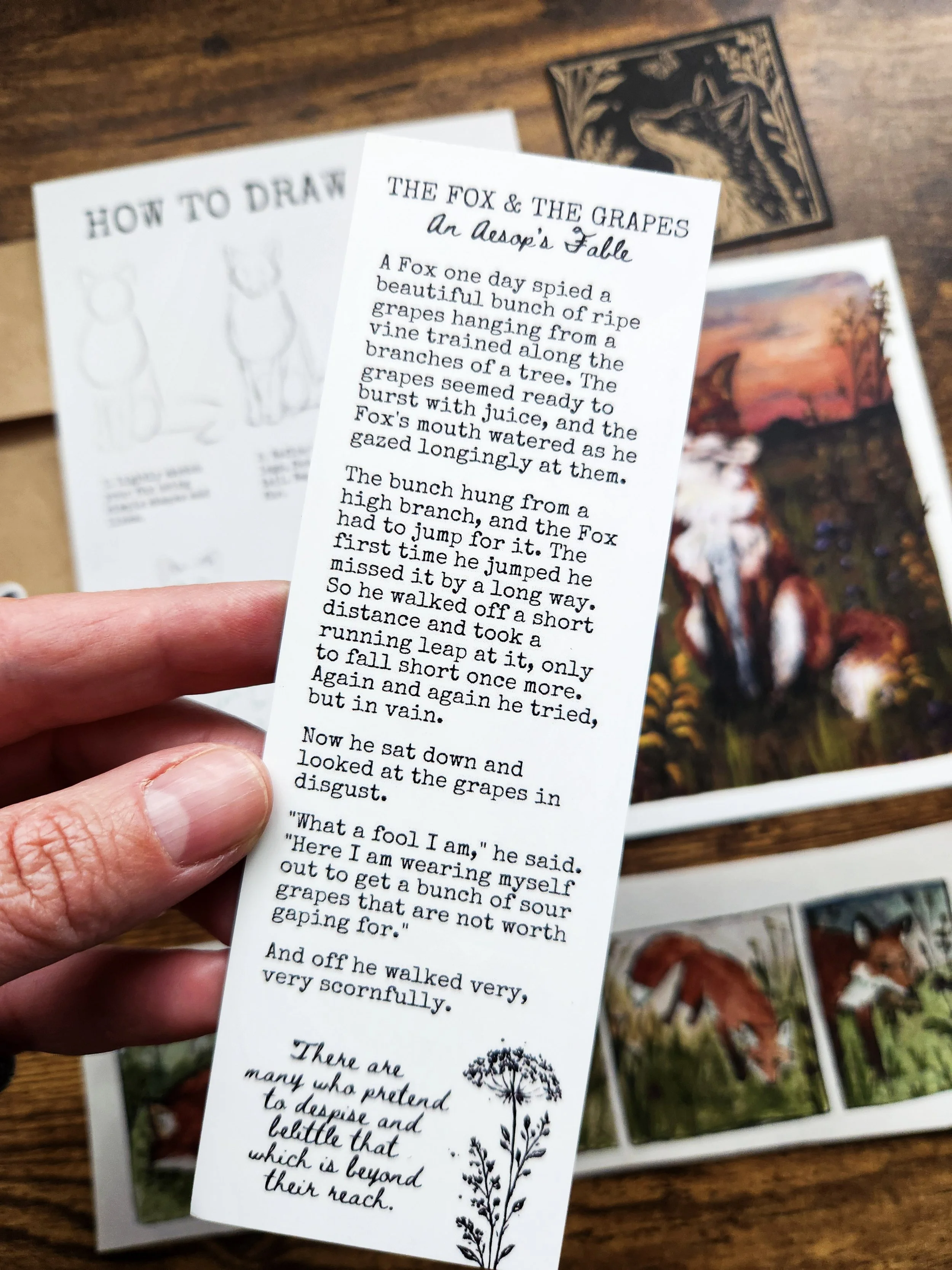 Close-up of bookmark back featuring Aesop's fable