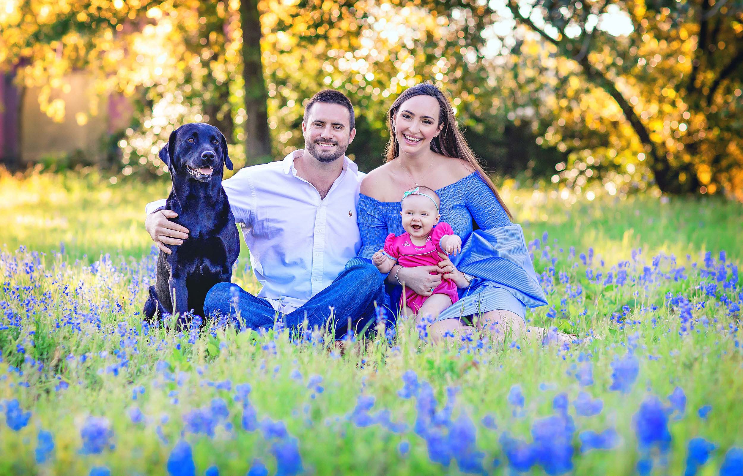  Vibrant and colorful family portrait in the bluebonnets in The Woodlands, Texas by spryART photography. 