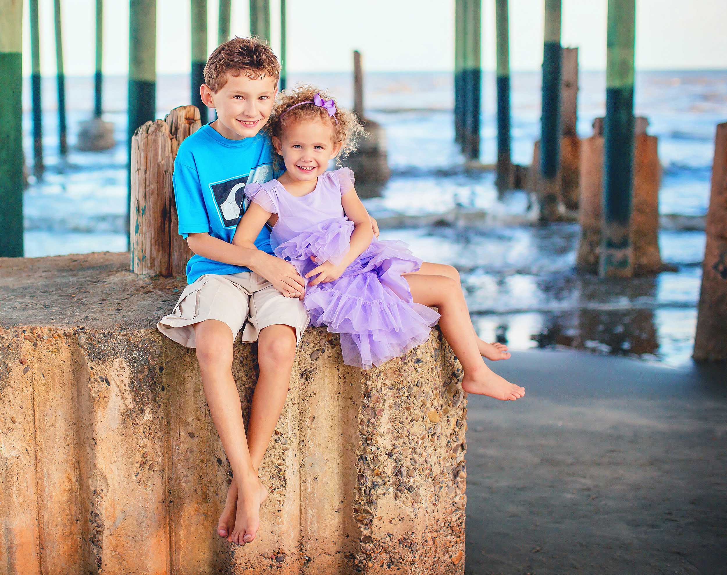  Siblings on pier in Galveston, Texas on the beach by spryART photography. 