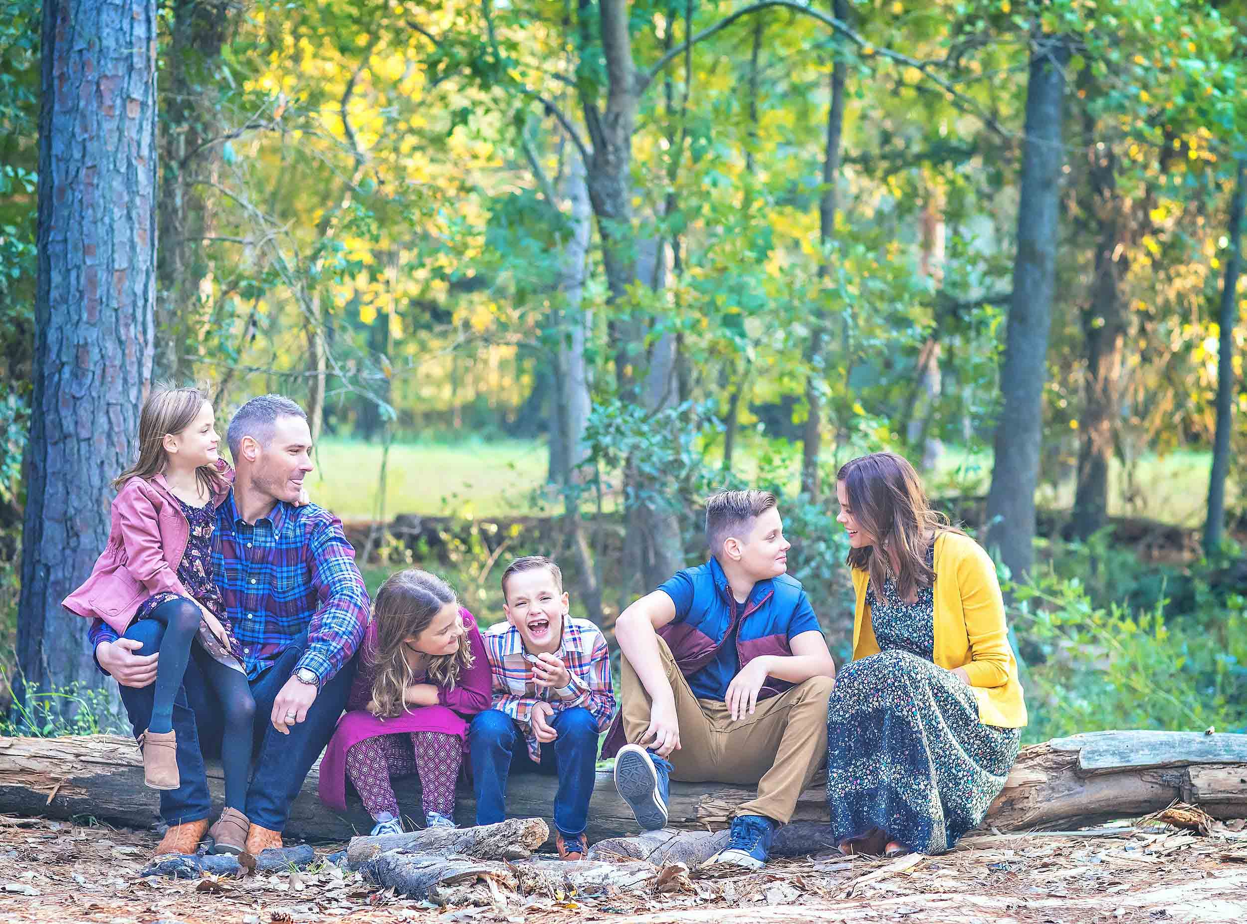  Outdoor lifestyle portrait of family in the woods in The Woodlands, Texas. 