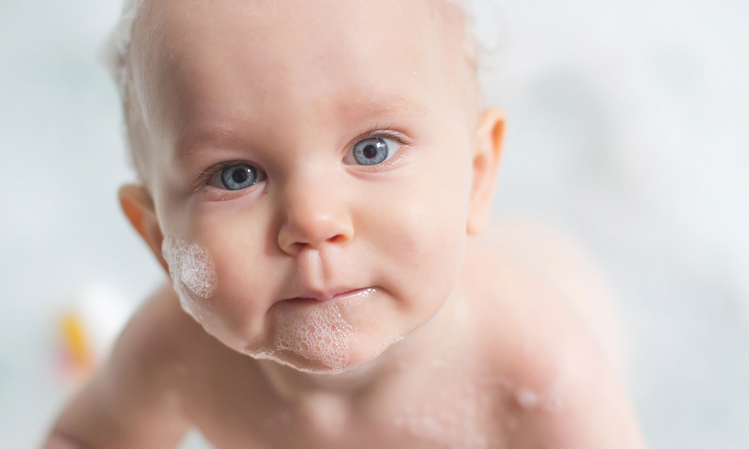  One year portrait of baby in bathtub by spryART photography. 