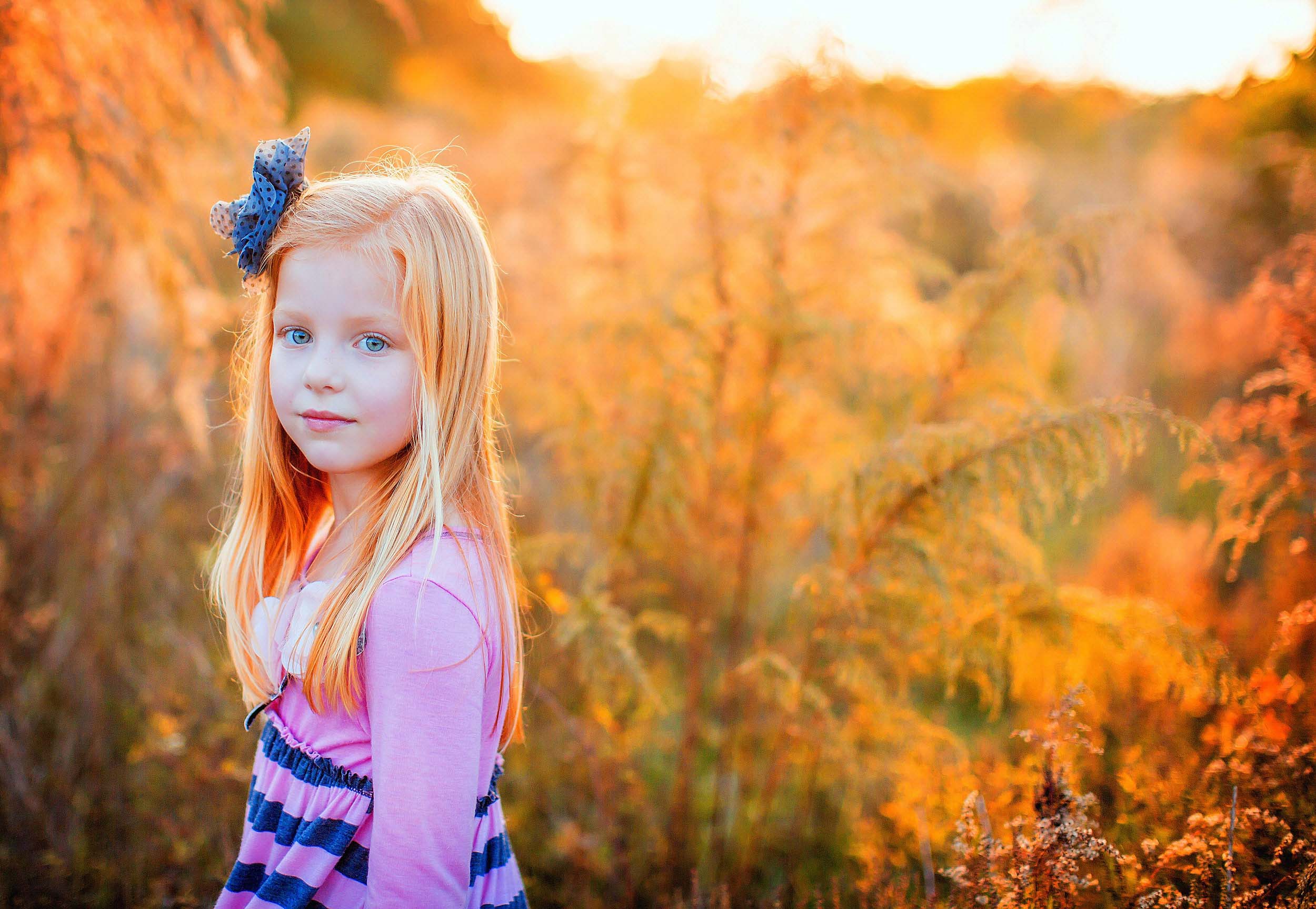  Portrait of red headed girl in field by family photographer spryART photography. 