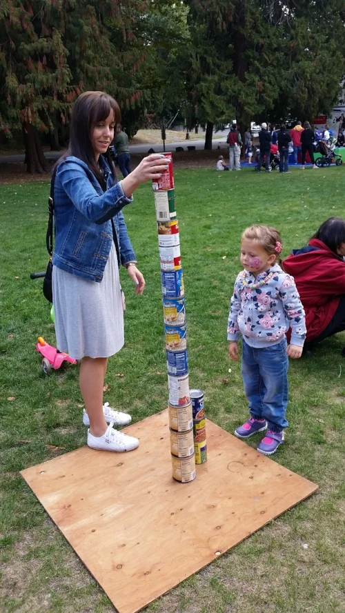 Building a skyscraper with cans of food collected at Mt. Baker Day at the Park
