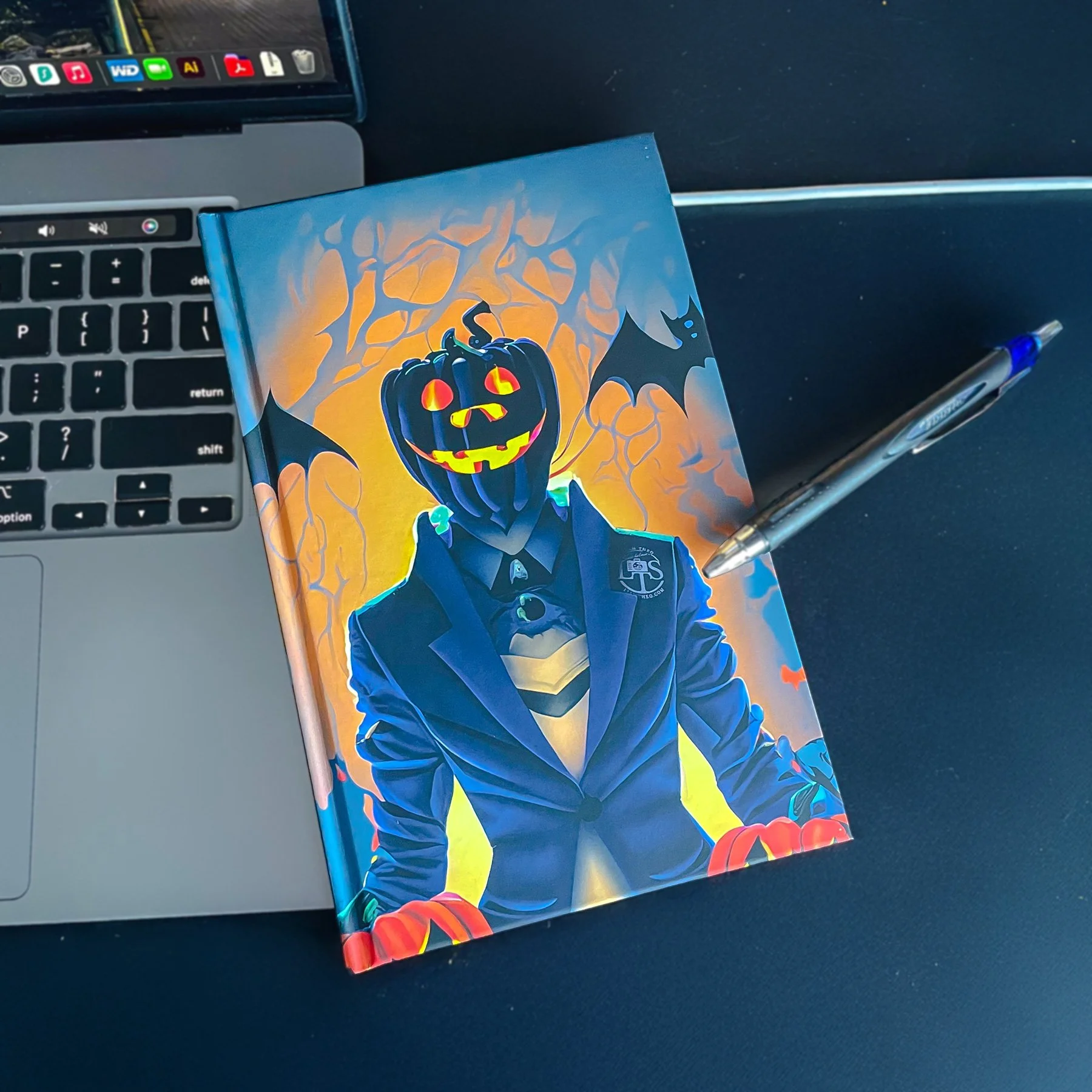 Liam Theo Creative's Pumpkin Head 5.5" x 8.5" Hardcover Notebook.