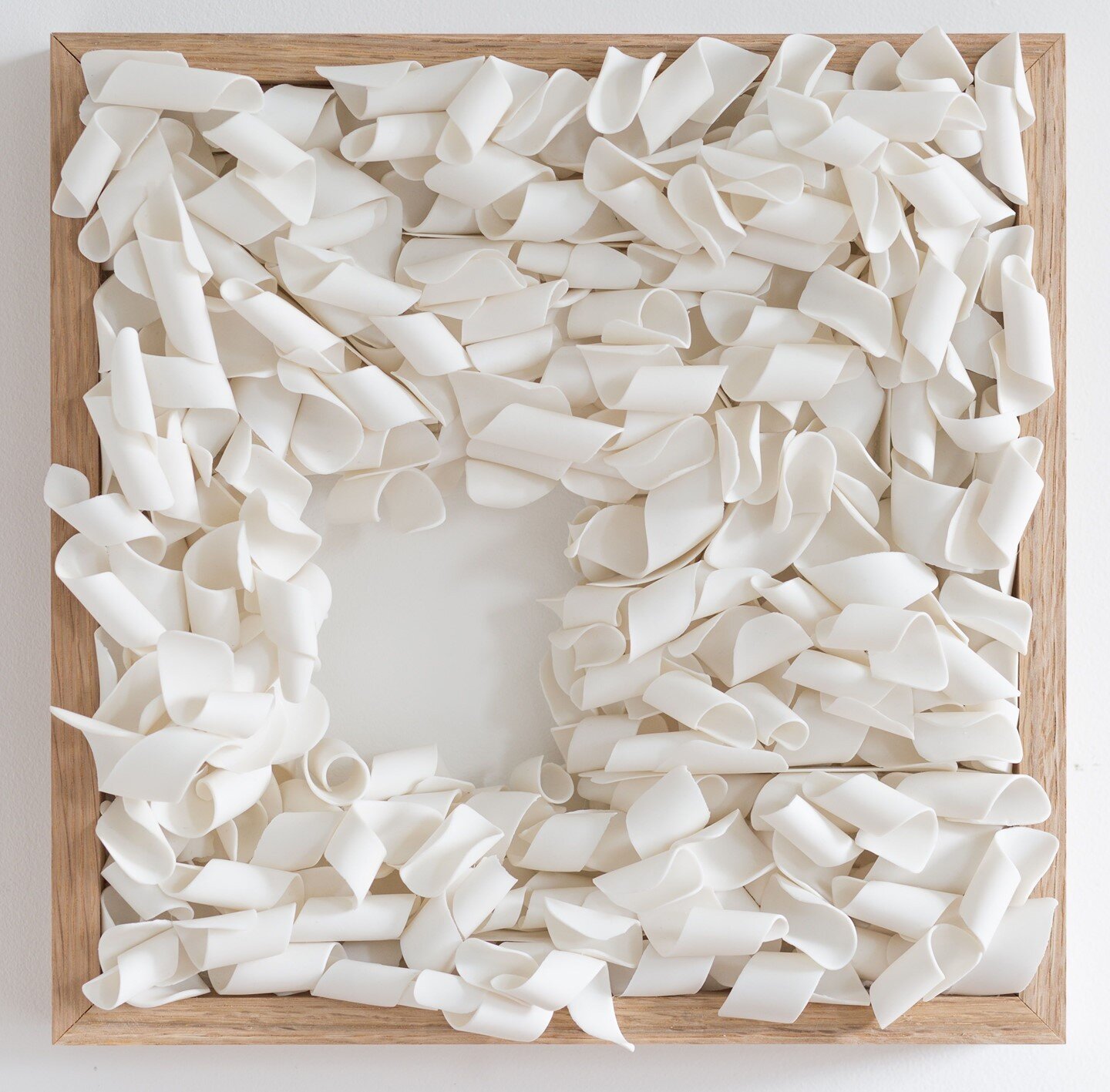 Another view of &lsquo;Accumulated memories&rsquo; with an opening. Hundreds of individual porcelain swirls, assembled one by one, carefully choosing each to sit well with another, building slowly to this tectonic formation.⁣
⁣
Oak frame, 30/30cm⁣
Le