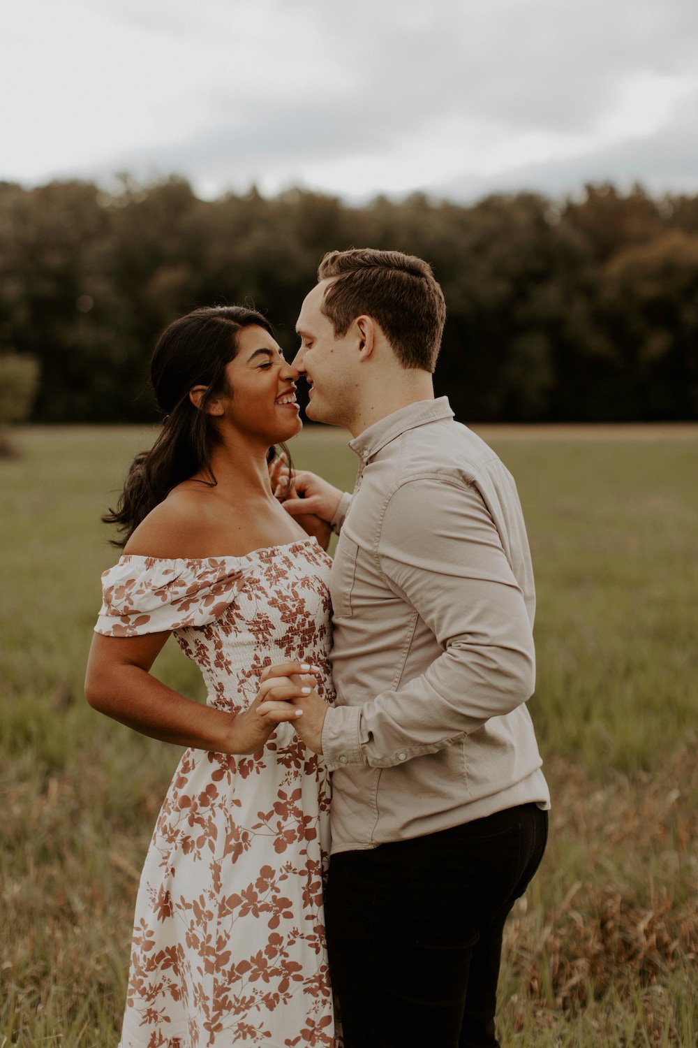 Floral patterned off-the-shoulder engagement photo dress.