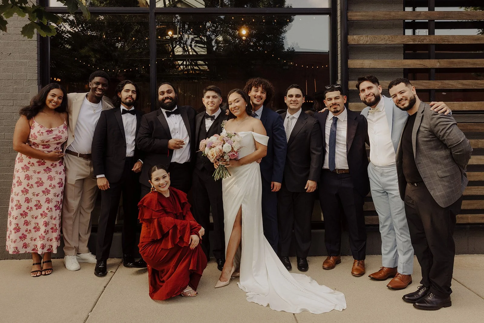 Newlyweds pose with guests outside The Ovation Chicago