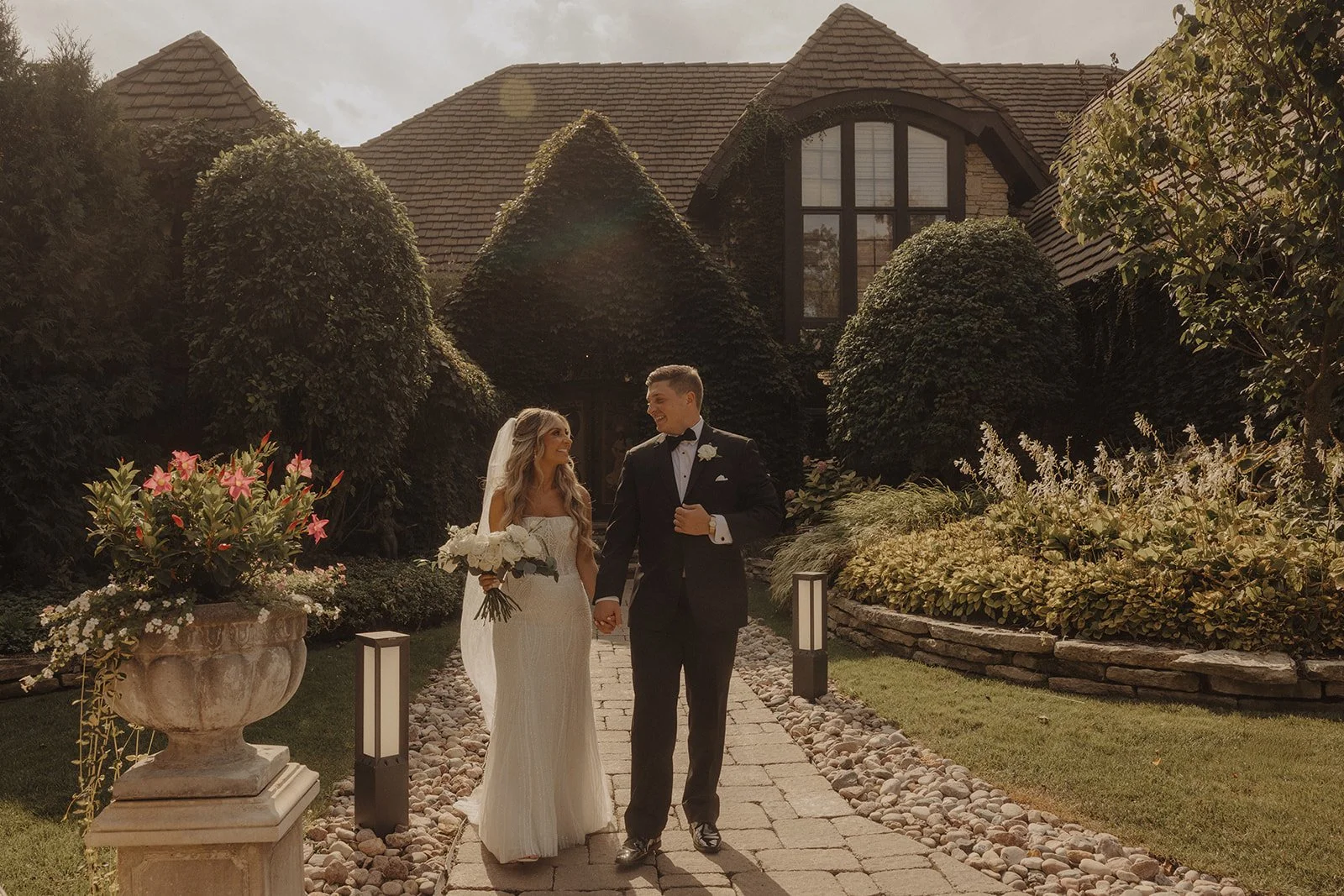 Newlyweds hold hands for bridal portaits following their Montebello Estates wedding in Lemont IL