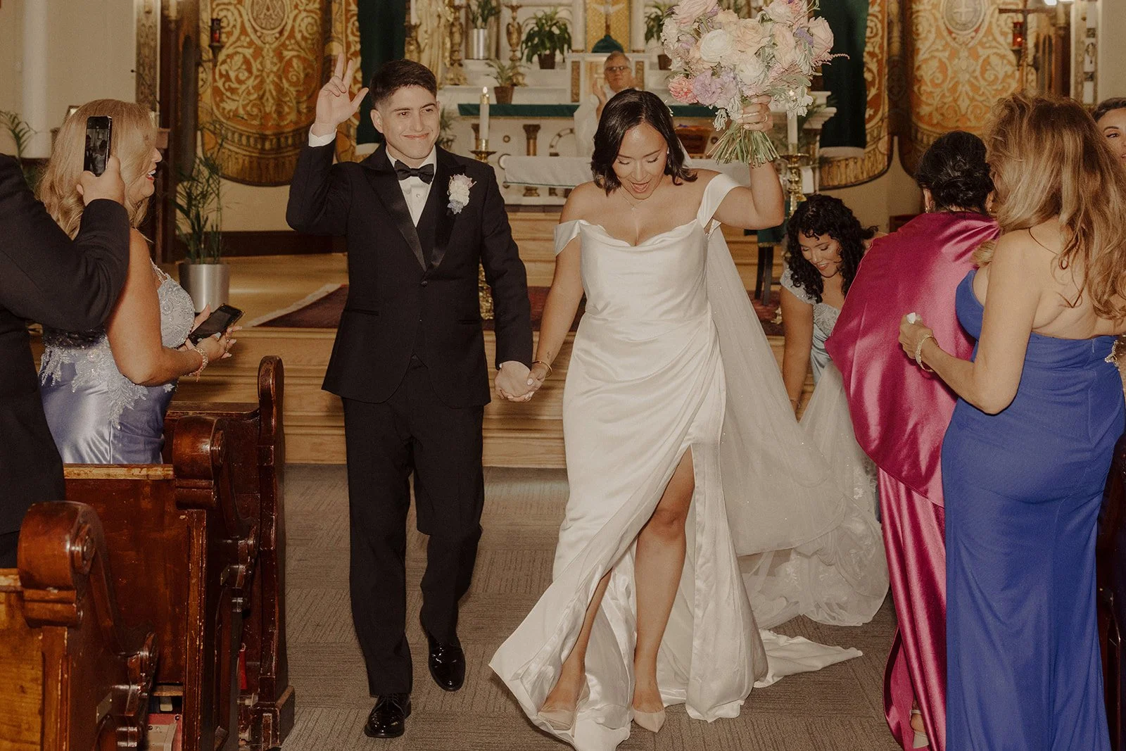 Newlyweds celebrate after exchanging vows at their Chicago wedding before an Ovation Chicago wedding reception.