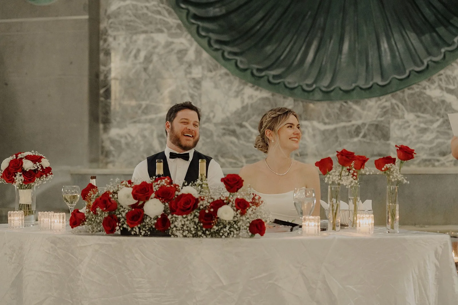 Newlyweds are seated at their winter wedding reception at Pazzos 311 Chicago.